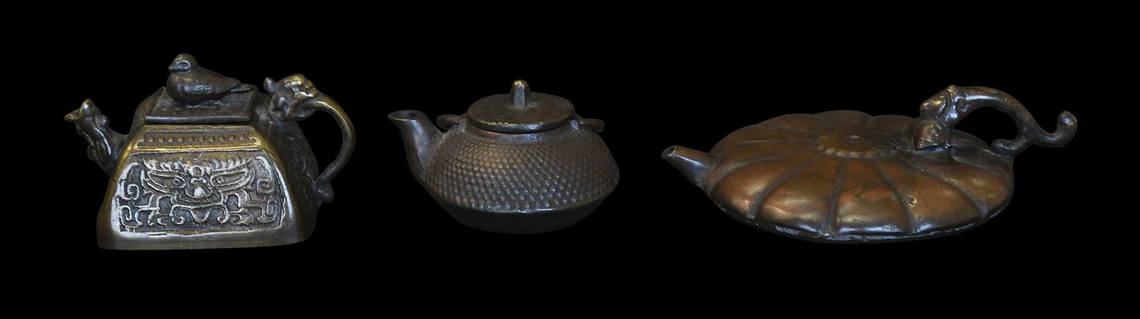 Three Japanese Bronze Water Droppers: early 20th century, unmarked, largest 1-1/4 x 5 x 3-3/4 in. Provenance: Private Collection, Highlands, North Carolina