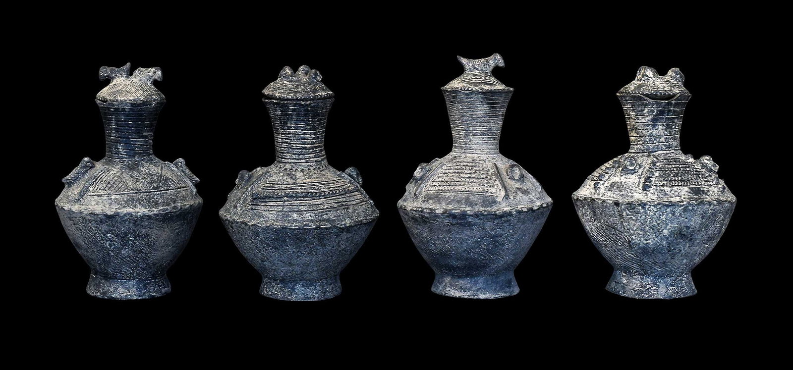 Four African Pottery Lidded Vases: probably Ashanti people, Ghana, each with raised decoration featuring linear patterns and birds, each approx. 8-3/4 x 5-3/4 x 5-3/4 in. Provenance: The Collection of William S. Arnett, Atlanta, Georgi