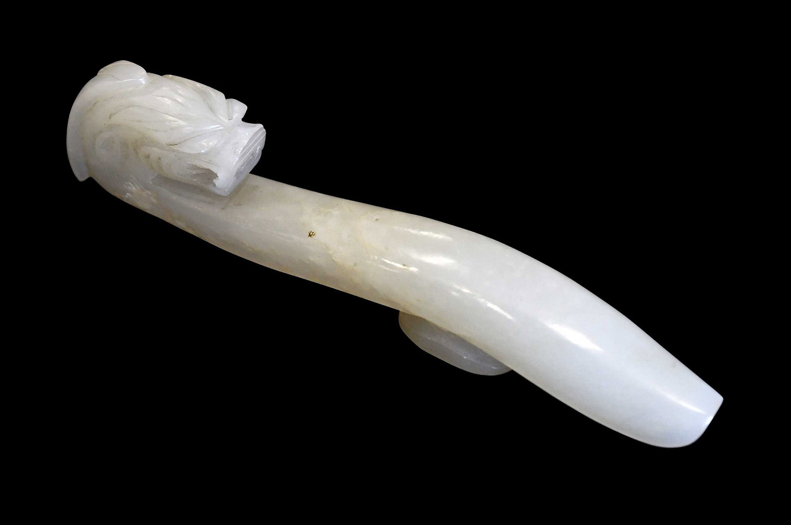 Chinese Carved Jade Dragon Belt Hook: semi-mottled pale green, 4-1/2 x 3/4 x 7/8 in. Provenance: The Collection of William S. Arnett, Atlanta, Georgia; sold to benefit Tinwood Foundation Note: This item tested as nephrite on the