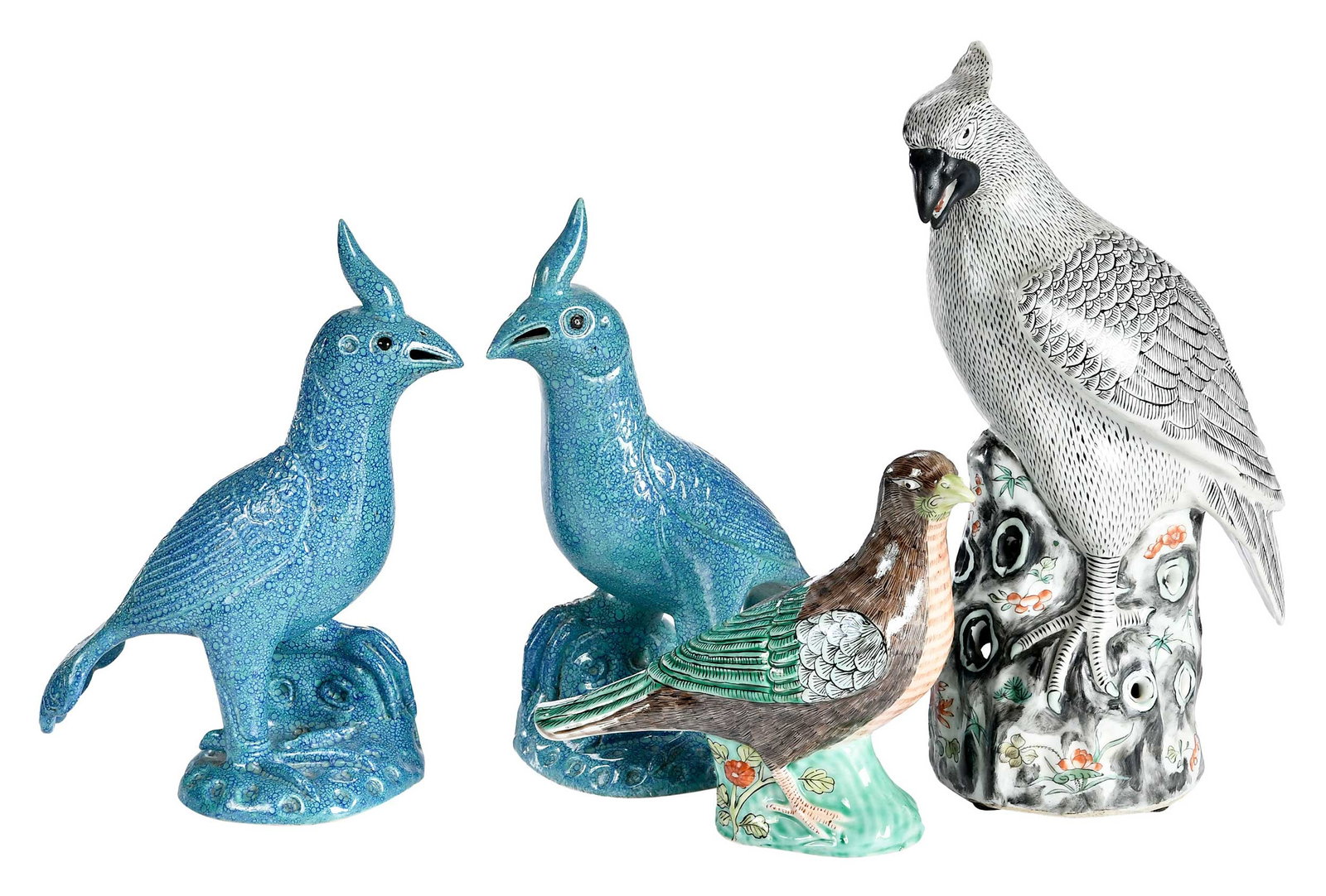 Four Chinese Export Porcelain Bird Figural Table Objects: comprising: large crested bird perched on rock; pair of blue shagreen glazed birds; smaller bird; largest 12-3/8 x 5 x 7 in. Provenance: The Collection of Joe Matthews and John Shank, Shepherdstown,