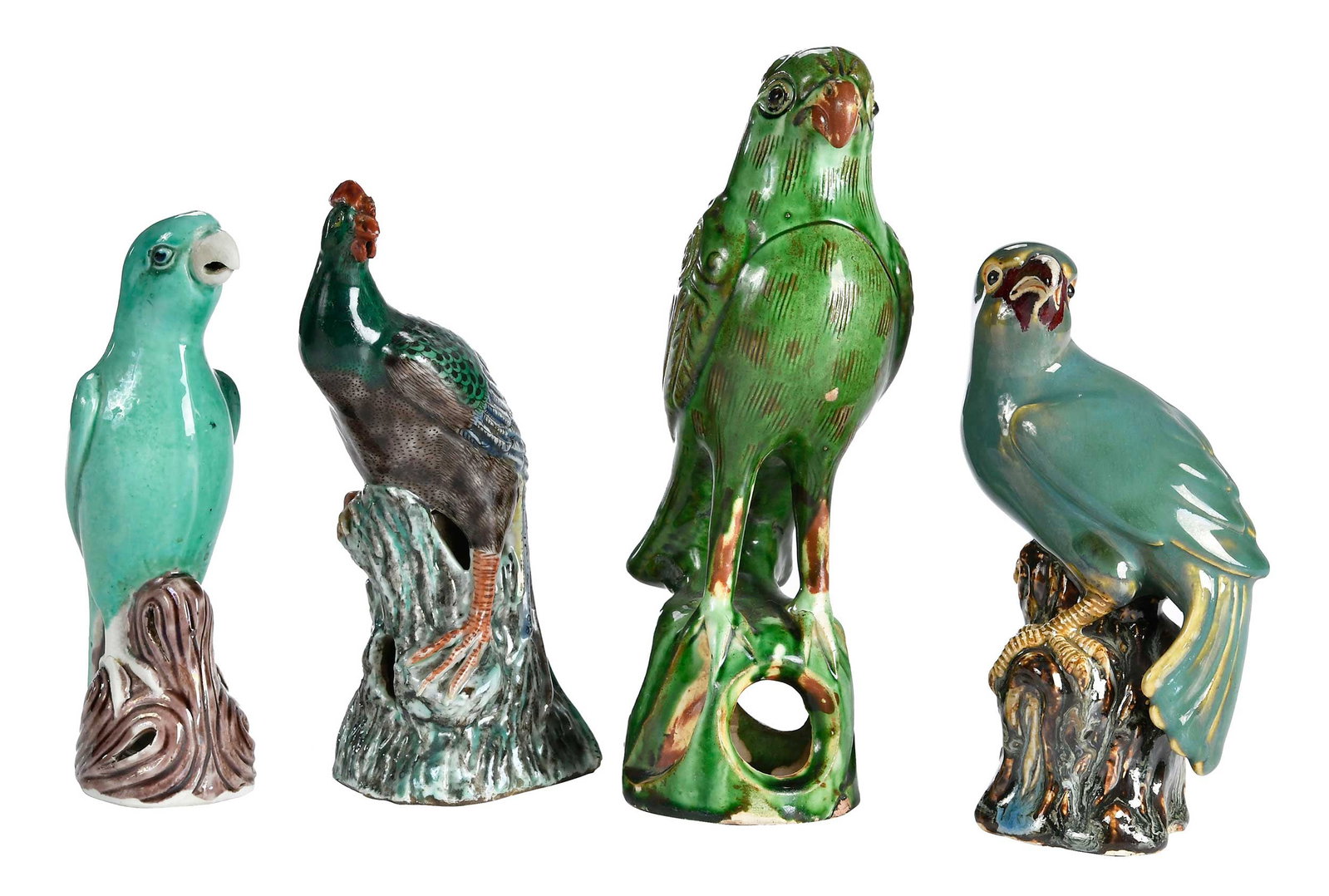 Four Chinese Export Porcelain Bird Figural Table Objects: probably 19th century, four green birds of varying form perched on stumps, largest 9 x 2-1/2 x 3-1/2 in. Provenance: The Collection of Joe Matthews and John Shank, Shepherdstown, West Virginia