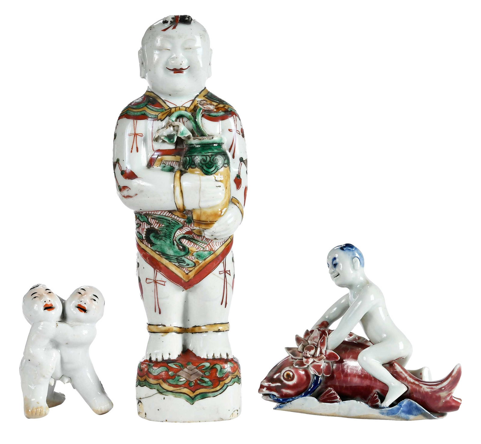 Three Chinese Export Figures of Boys: boy riding carp; standing figure holding vase; pair of wrestling boys, 10-1/2 x 3-1/2 x 2-3/4 in. Provenance: The Collection of Joe Matthews and John Shank, Shepherdstown, West Virginia