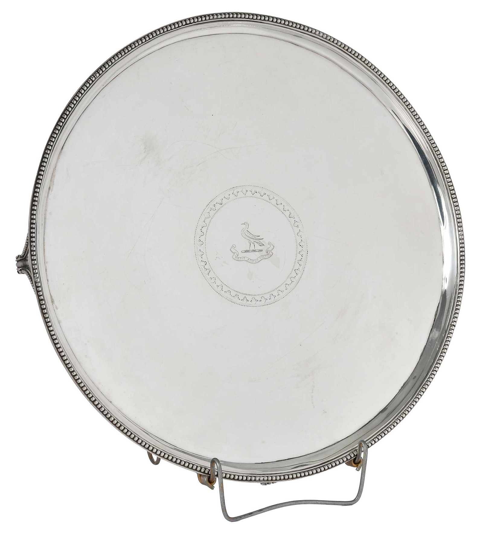 George III English Silver Footed Tray, John Hutson: London, 1789, round bead border, central cartouche with crest, four feet, marks for John Hutson, .925 fine, 60.70 oz. T., 2 x 16 in. Provenance: The Collection of Joe Matthews and John Shank,