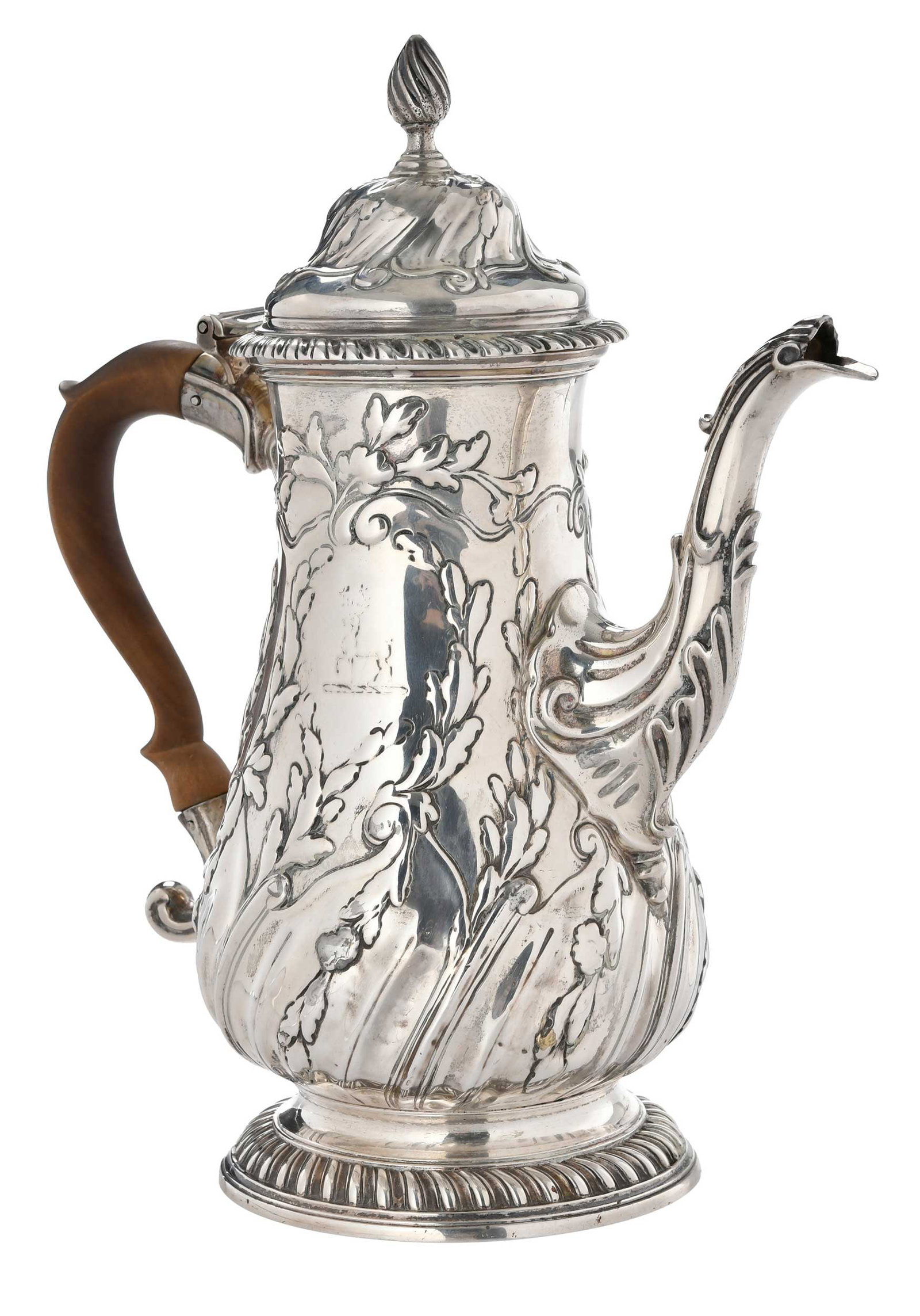 George III English Silver Coffee Pot, Francis Crump: London, 1766, pear form with later decoration. wooden handle, crest, marks for Francis Crump, .925 fine, 28.35 oz. T., 11-3/4 in. Provenance: The Collection of Joe Matthews and John Shank,