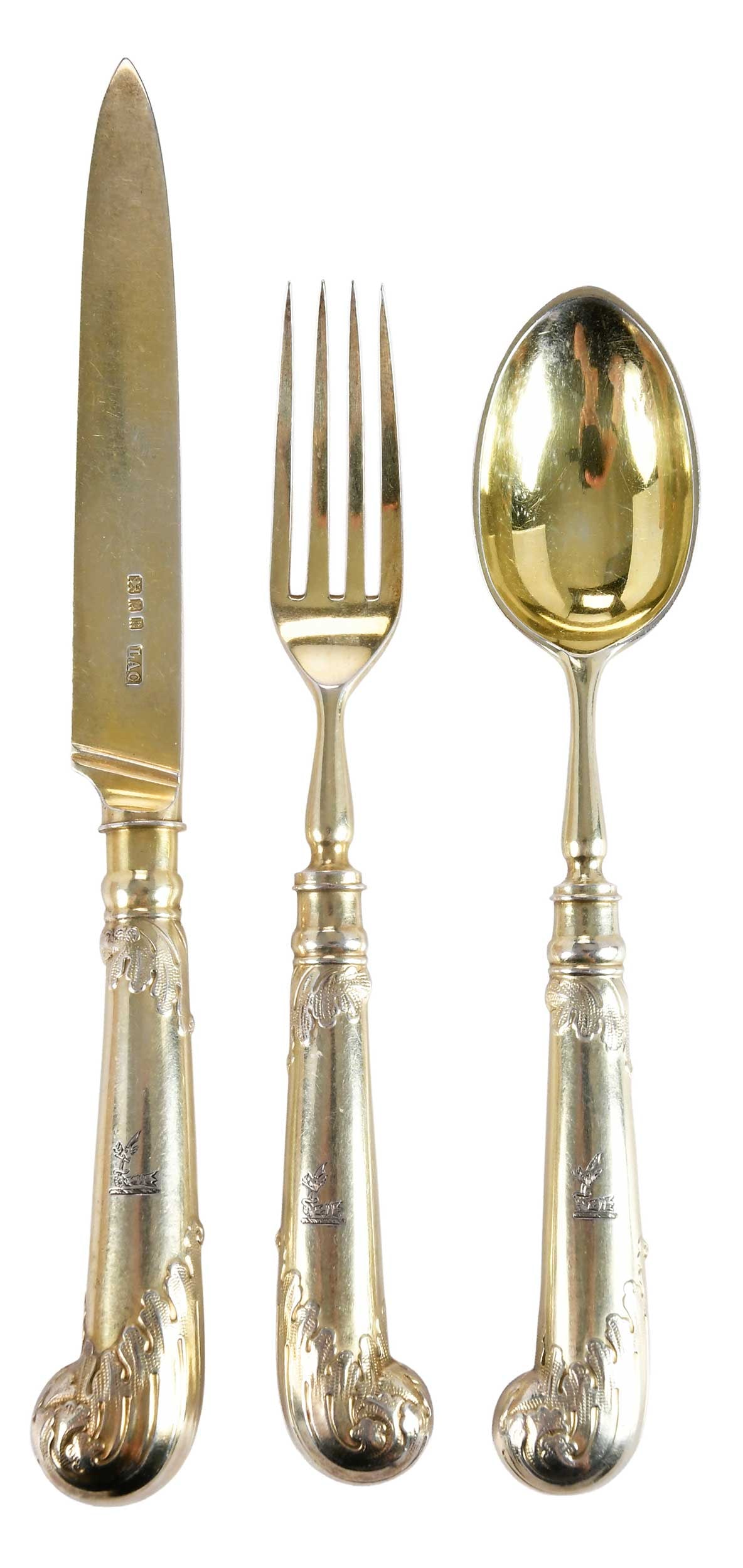 24 Piece English Gilt Silver Flatware, Crichton Brothers: London, 1925-1928, all with hollow handle pistol grips, English sliver blades, bowls and tines, matching crest: eight each of 8-1/2 in. knives; 7 in. forks; 7 in. spoons, marks for Crichton Brothers, 