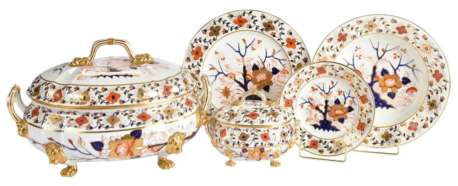 45 Piece Derby Porcelain Dinner Service in the Imari Palette: English, 19th century, varying iron red Derby marks to undersides of bases, comprising: footed lidded tureen, two footed lidded sauce tureens, 18 dinner plates, 12 soup plates, 12 small/side plates,