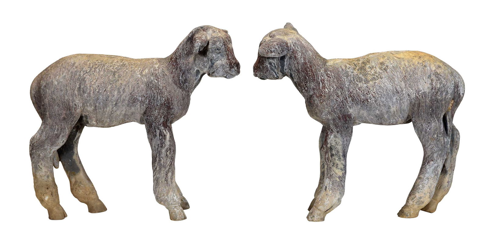 Pair of English Lead Lamb Garden Sculptures: early/mid 20th century, one marked "MADE IN ENGLAND" under hoof , 17-3/4 x 21 x 8 in. Provenance: The Collection of Joe Matthews and John Shank, Shepherdstown, West Virginia