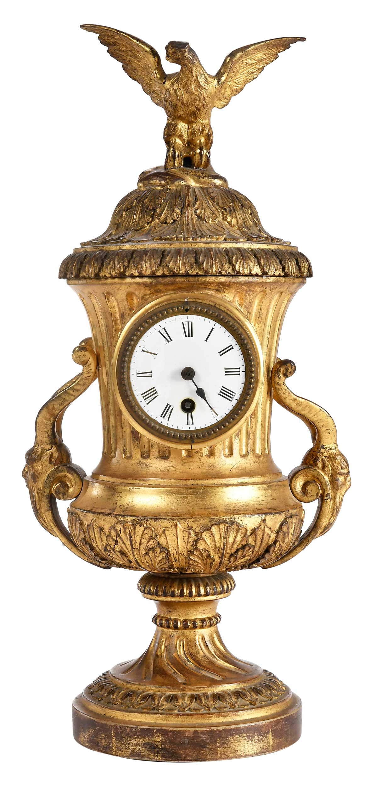French Carved Giltwood Urn Form Mantel Clock: 18th/19th century, enamel dial with Roman numerals set in carved giltwood case with goat mask side handles and eagle finial, removable panel at back opening to works, with pendulum and weights, 20 x