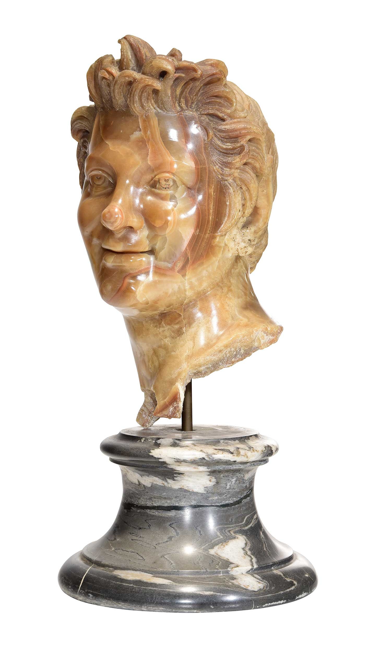 Italian School Sculptural Bust of a Faun: (19th century) carved onyx on a gray marble socle, overall 19 x 9 x 9 in. Provenance: The Collection of Joe Matthews and John Shank, Shepherdstown, West Virginia