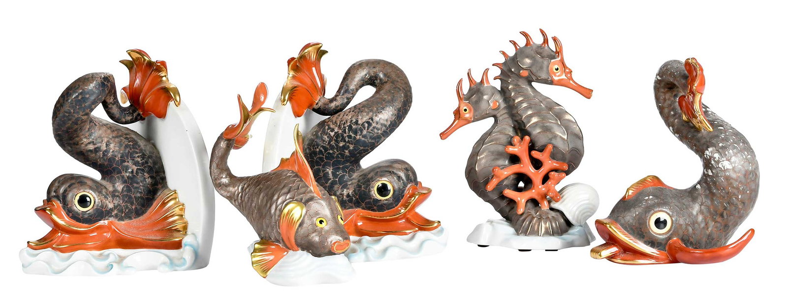 Five Herend Porcelain Sea Creature Table Objects: 20th century, Herend marks to bases, comprising: pair of dolphin bookends; dolphin; large fish; seahorse figural group; largest 7 x 6 x 5-1/2 in. Provenance: The Collection of Joe Matthews and John