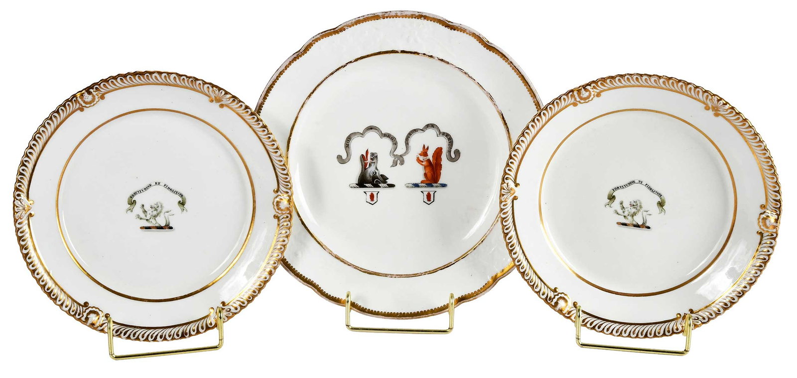 Three English Armorial Porcelain Plates, Grainger Lee & Co. Worcester and Spode: 19th century, comprising: pair of Grainger Lee & Co. Worcester plates with ermine lion crest with black and gold torse under banner with motto "Fortitudine et Fidelitate", possibly Clan Farquharson,