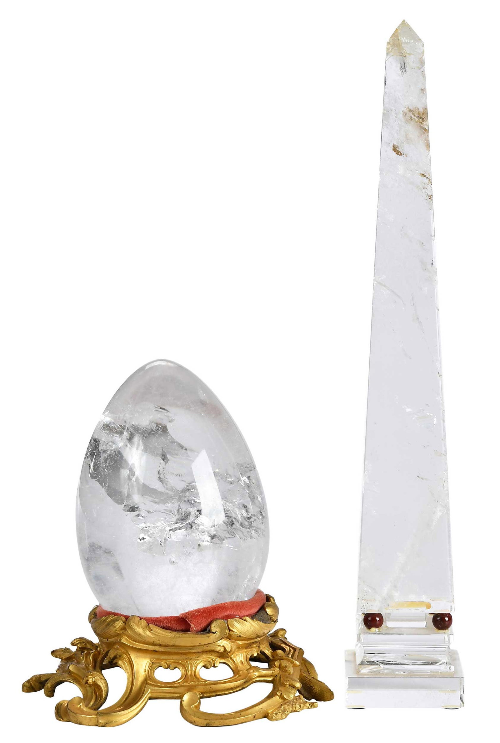 Two Rock Crystal Table Objects, Obelisk and Large Egg with Gilt Base: Continental, comprising: 20th century, rock crystal obelisk with marble sphere supports, Nardi Sergio/Venezia retail label to underside of base; large egg with gilt associated gilt metal base; larger
