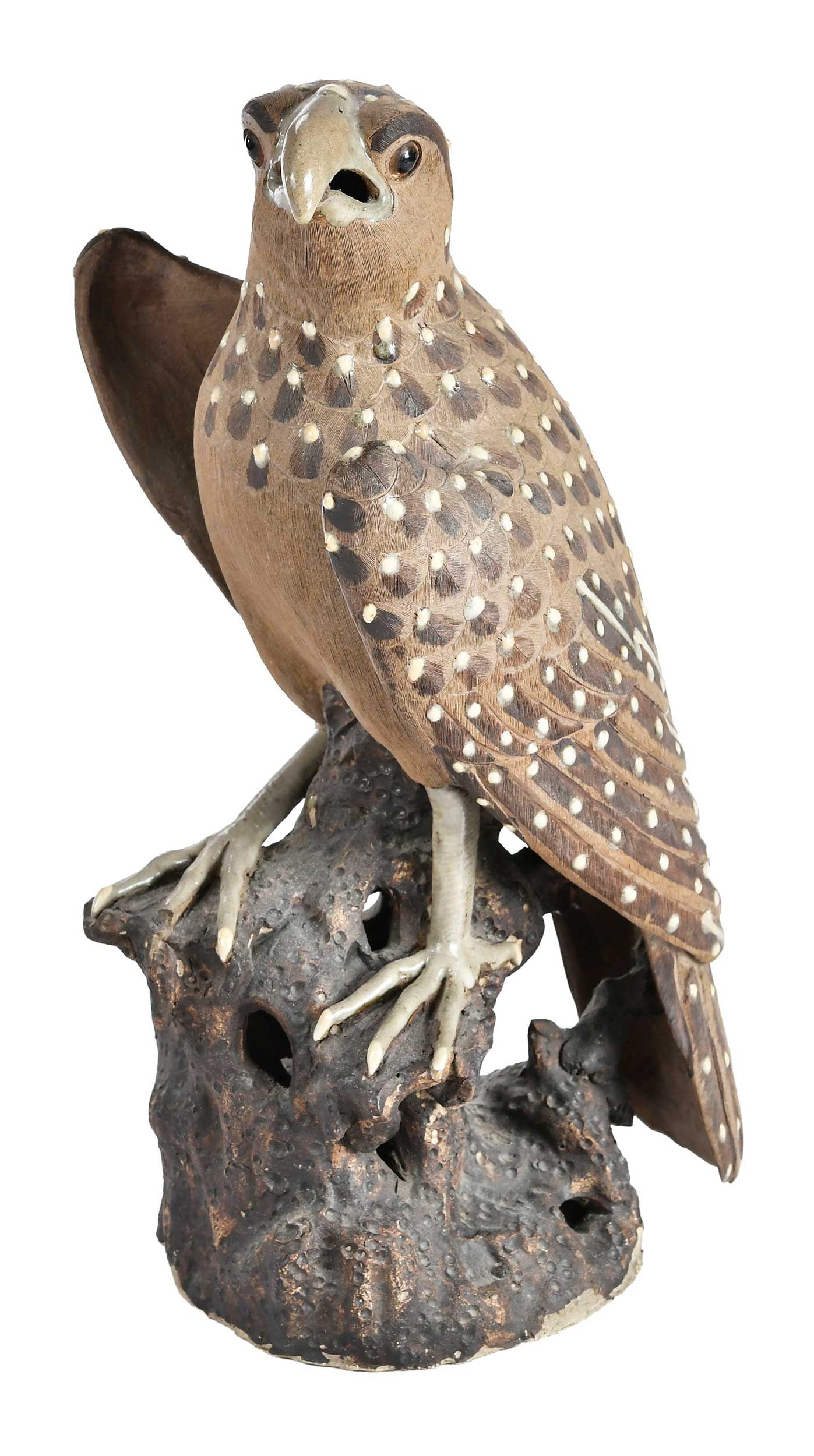 Chinese Partially Glazed Ceramic Falcon: 19th century, character mark to underside, perched atop naturalistic base, 13-3/4 x 6-1/2 x 5-3/4 in. Provenance: The Collection of Joe Matthews and John Shank, Shepherdstown, West Virginia Note: A
