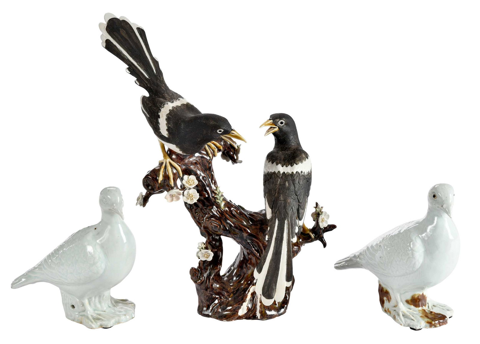 Three Chinese Export Porcelain Bird Figures: 20th century, pair of doves; magpie figural group on naturalistic branch form base, stamped "Made in China"; larger approx. 13-3/4 x 10 x 9 in. Provenance: The Collection of Joe Matthews and John Shan