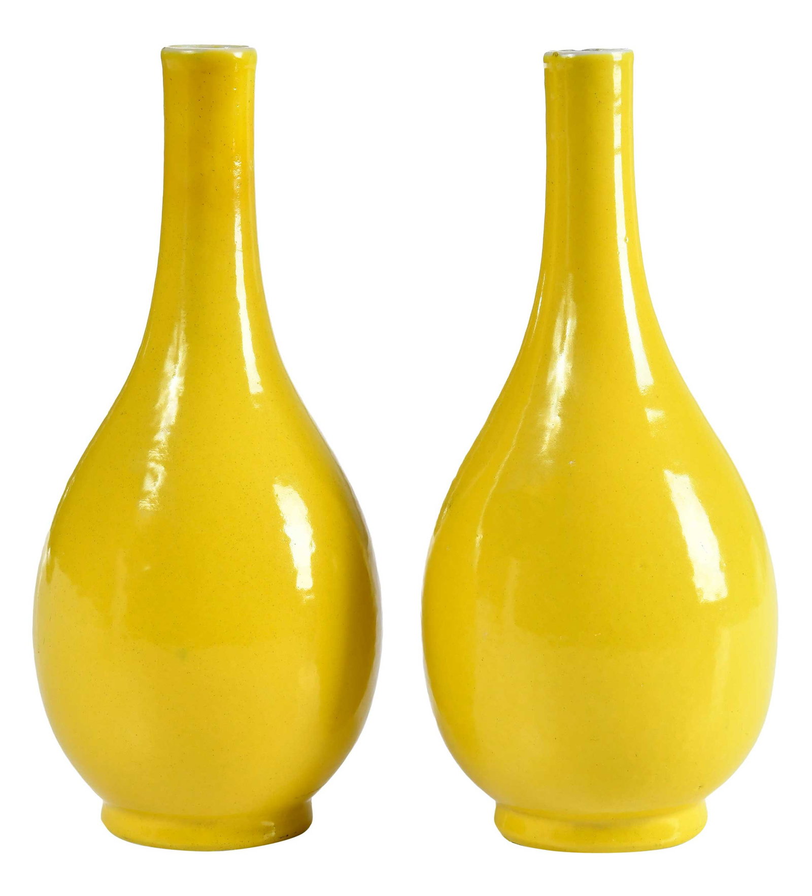 Pair of Chinese Yellow Glazed Porcelain Bottle Vases: possibly 19th century, bright yellow glaze, underglazed blue rings to undersides, 8 x 3-1/2 x 3-1/2 in. Provenance: The Collection of Joe Matthews and John Shank, Shepherdstown, West Virginia