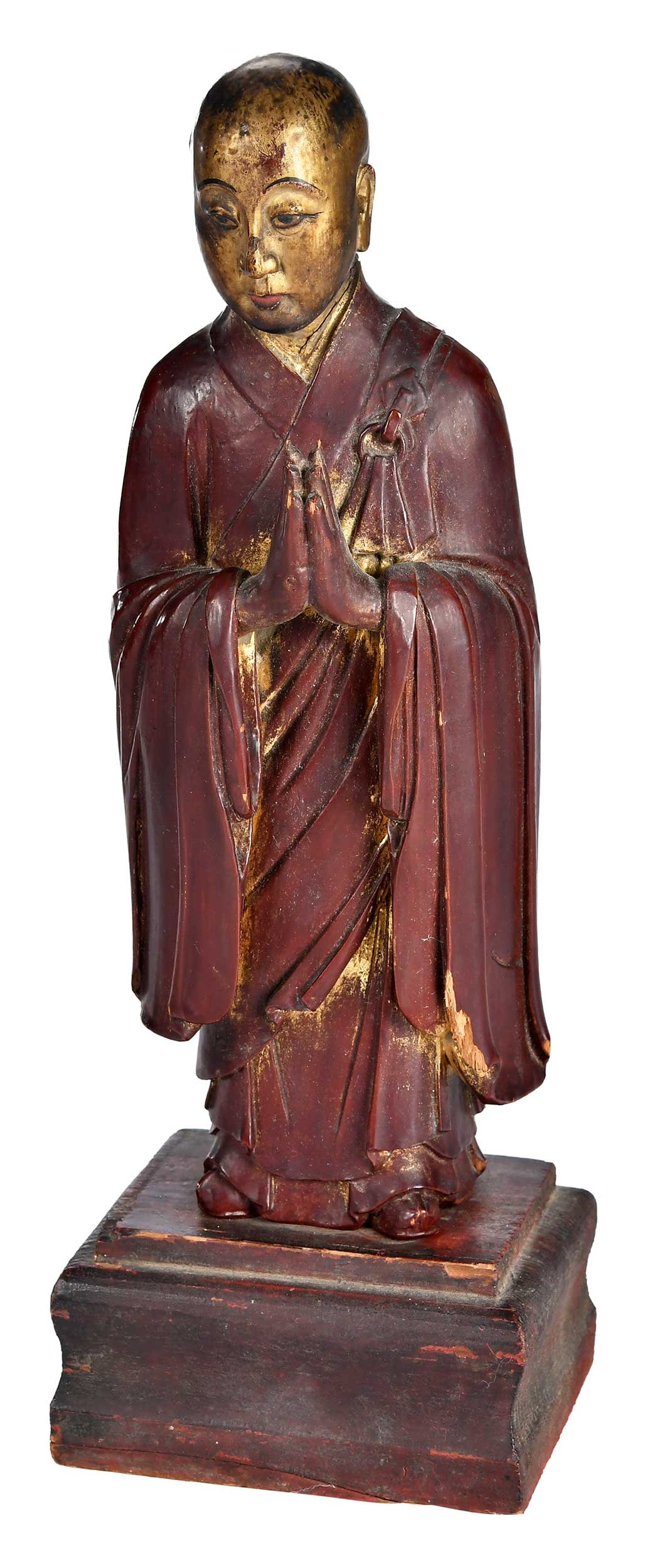 Carved, Lacquered, and Gilt Standing Buddhist Arhat Figure: probably Japanese, 19th century, standing robed monk with hands raised in anjali mudra, with wood base with recessed slot for standing figure, 13-1/4 x 14-1/4 x 3-1/2 in. Provenance: The Collection