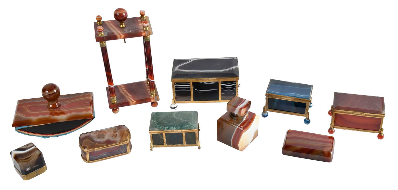 10 Assorted Brass and Stone Boxes and Desk Accessories: late 19th/20th century, agate and other hardstone construction with brass frames, comprising: five boxes; two paperweights; inkwell; rocking ink blotter; pocket watch stand; largest 7-1/4 x 3-1/4 x