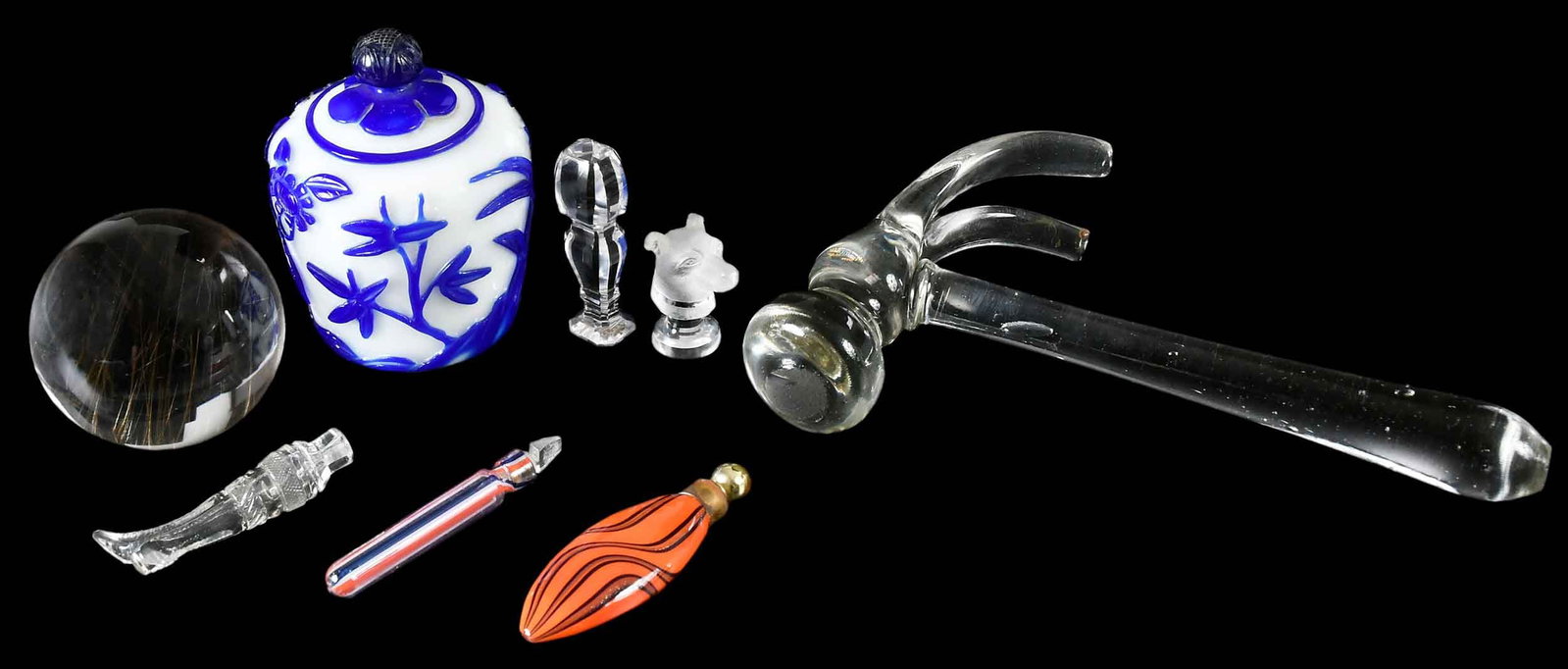 Collection of Glass Table Articles: comprising blue on white Peking glass urn, glass hammer, sphere with gold threading, cut glass "crown over N" seal, cut glass boot form scent bottle, two art glass scent bottles, frosted glass seal fo