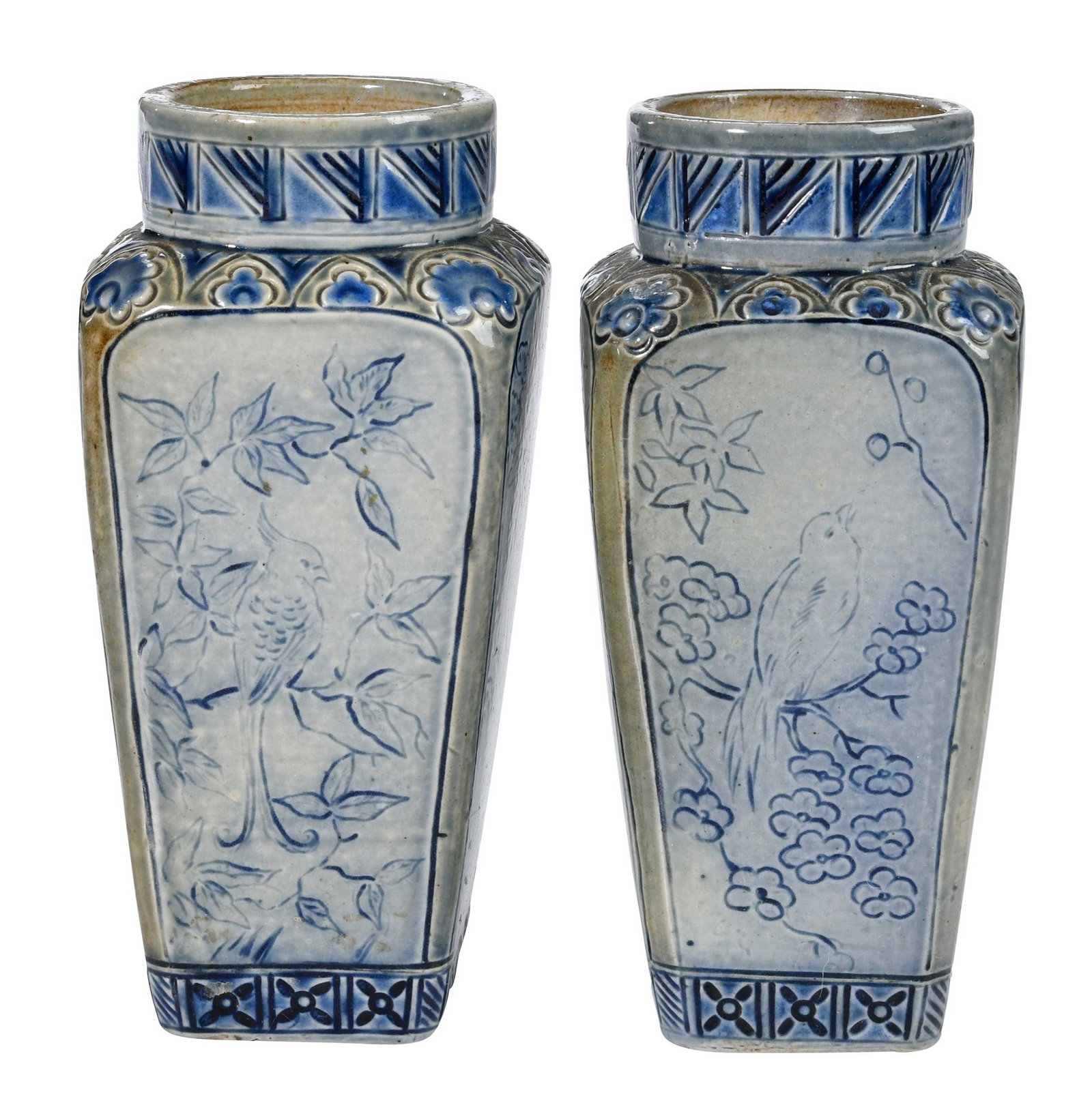 Pair of British Robert Wallace Martin Vases For Martin Brothers: London, England, late 19th century, salt glazed, incised cobalt avian scenes to four panel sides, incised cobalt geometric decorations to base edge and neck, relief carved shell and floral motif at