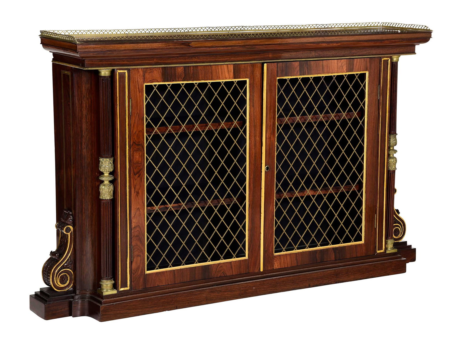 William IV Style Brass Inlaid Rosewood Grille Door Bookcase: mid to late 19th century, top with heart motif gallery, two doors with shelved interior, flanked by reeded brass mounted columns and foliate carved scrolls, 62 x 36-3/4 x 12 in. Provenance: Private