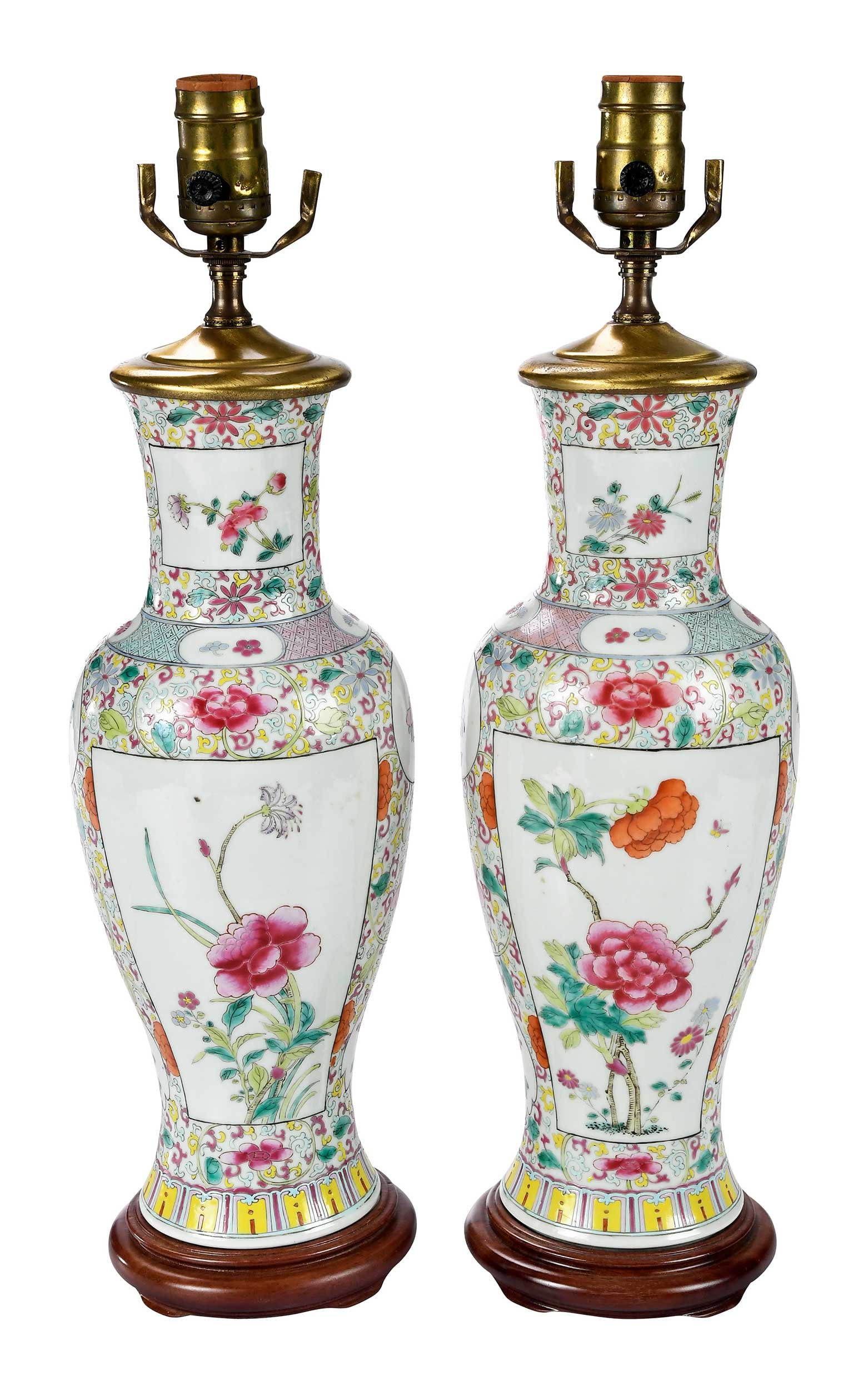 Pair of Chinese Export Famille Rose Porcelain Vases Converted to Lamps: late 18th/early 19th century, wood bases, imitation jade finials, each 26-3/4 x 5-1/2 x 5-1/2 in. (with harp to top of finial) Provenance: Private Florida Collection