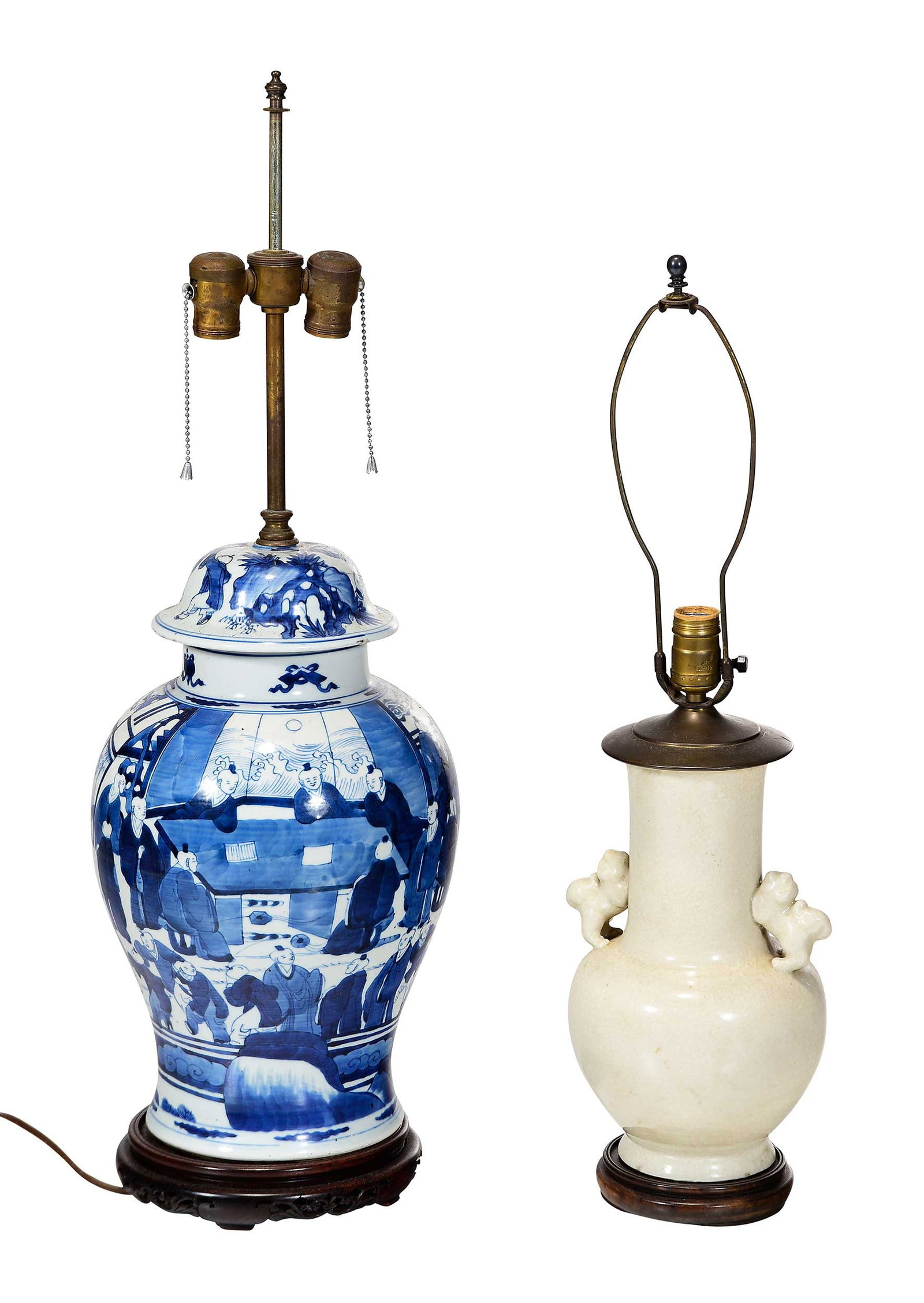 Two Chinese Porcelain Vases Mounted as Lamps: 19th century, one blue and white covered jar, one cream glazed vase with foo lion handles, mounted on wood bases, larger 31 x 11 x 11 in. to finial, each wired for electricity Provenance: Property of 