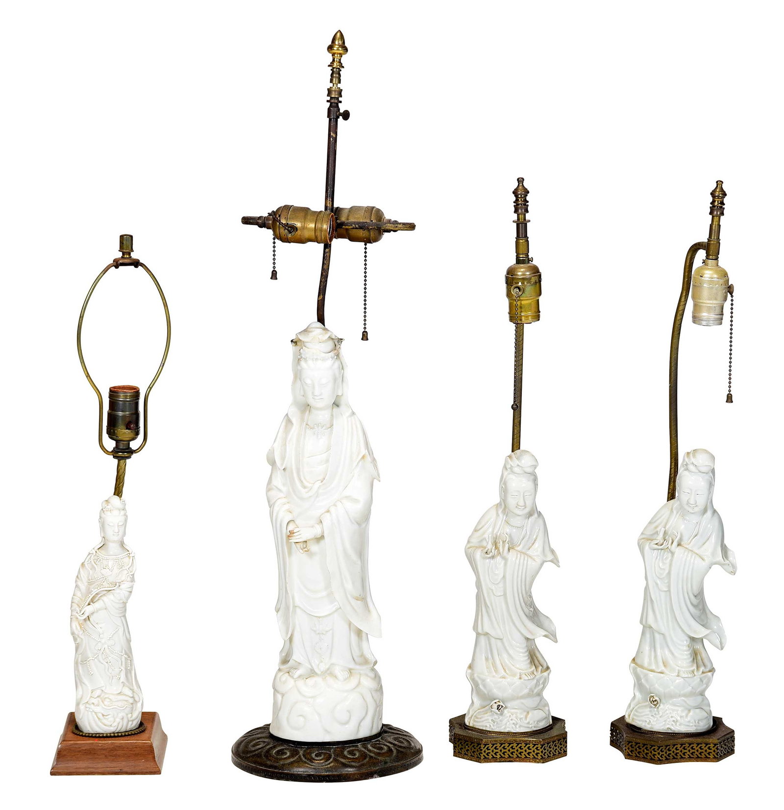 Four Chinese Blanc de Chine Guanyin Mounted as Lamps: late 19th/early 20th century, of varying size and form, including a pair, largest 30 x 8 x 8 in. to finial, each wired for electricity Provenance: Property of a South Carolina Collector