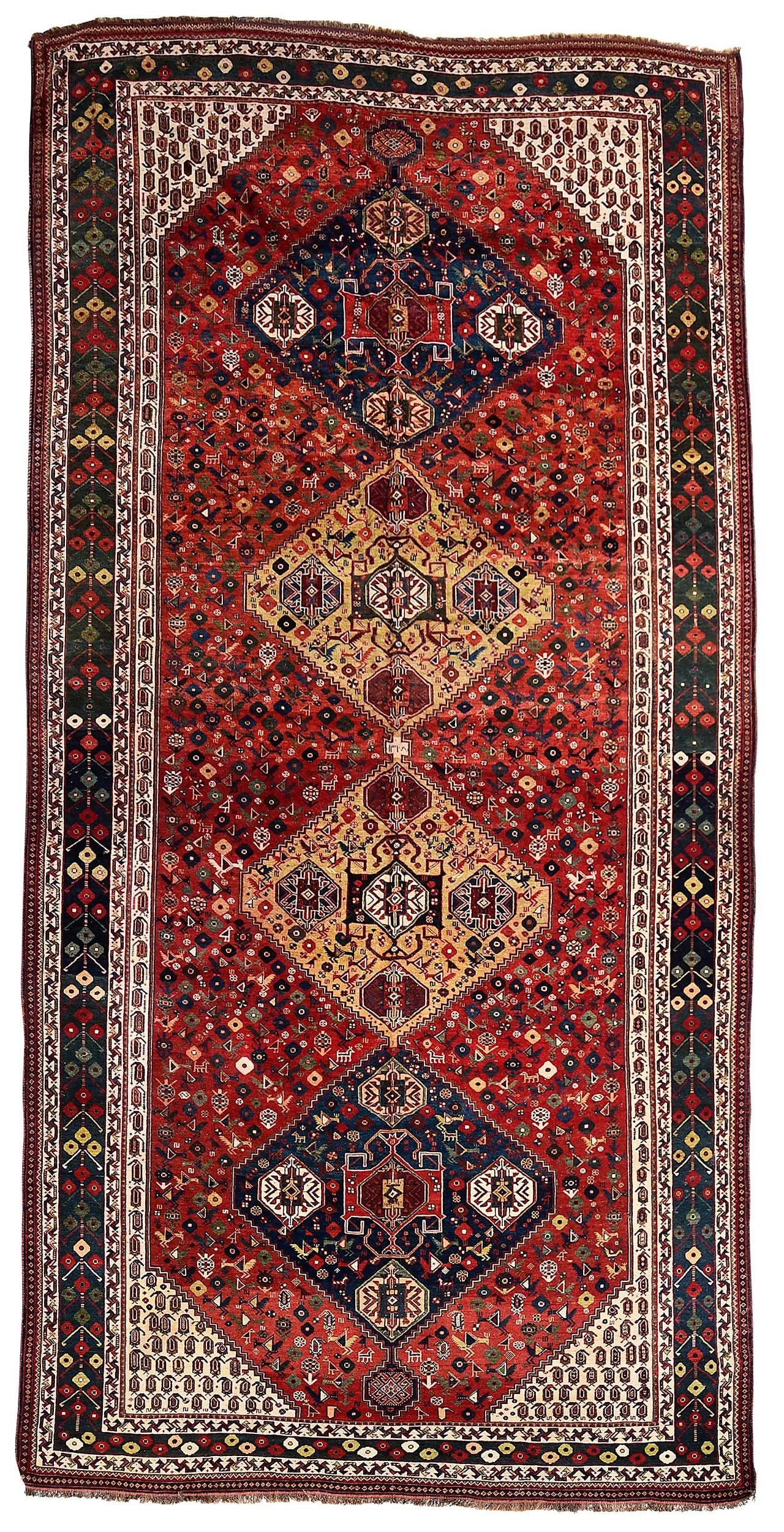 Signed Shiraz Gallery Carpet: mid 20th century, four medallions on red ground with birds, boteh spandrels, inscription to middle, 13 ft. x 7 ft. 