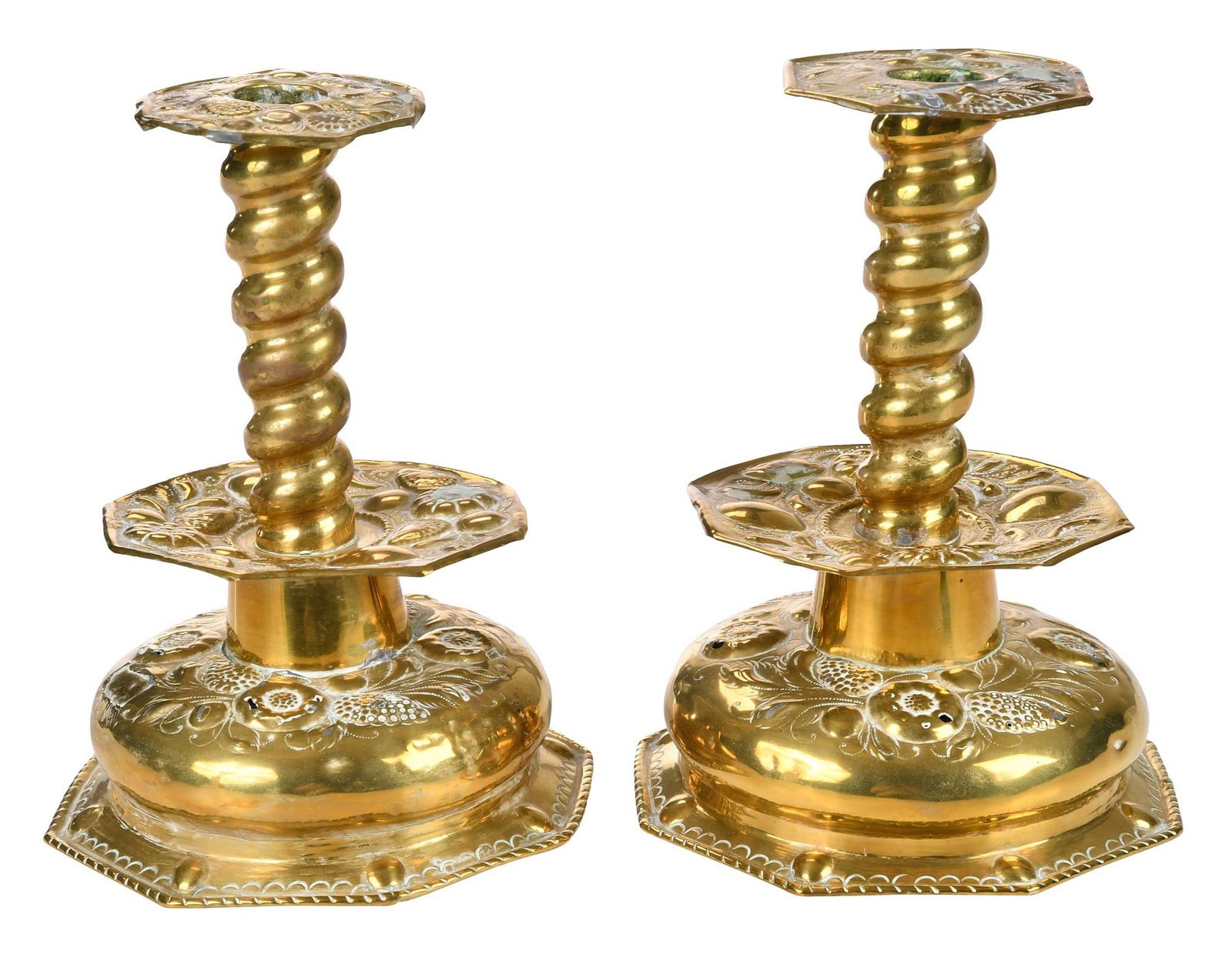 Pair of Continental Brass Repousse Candlesticks: probably Dutch, 18th century, raised floral decoration, 8-3/4 x 7 x 7 in. Provenance: Private North Carolina Collection