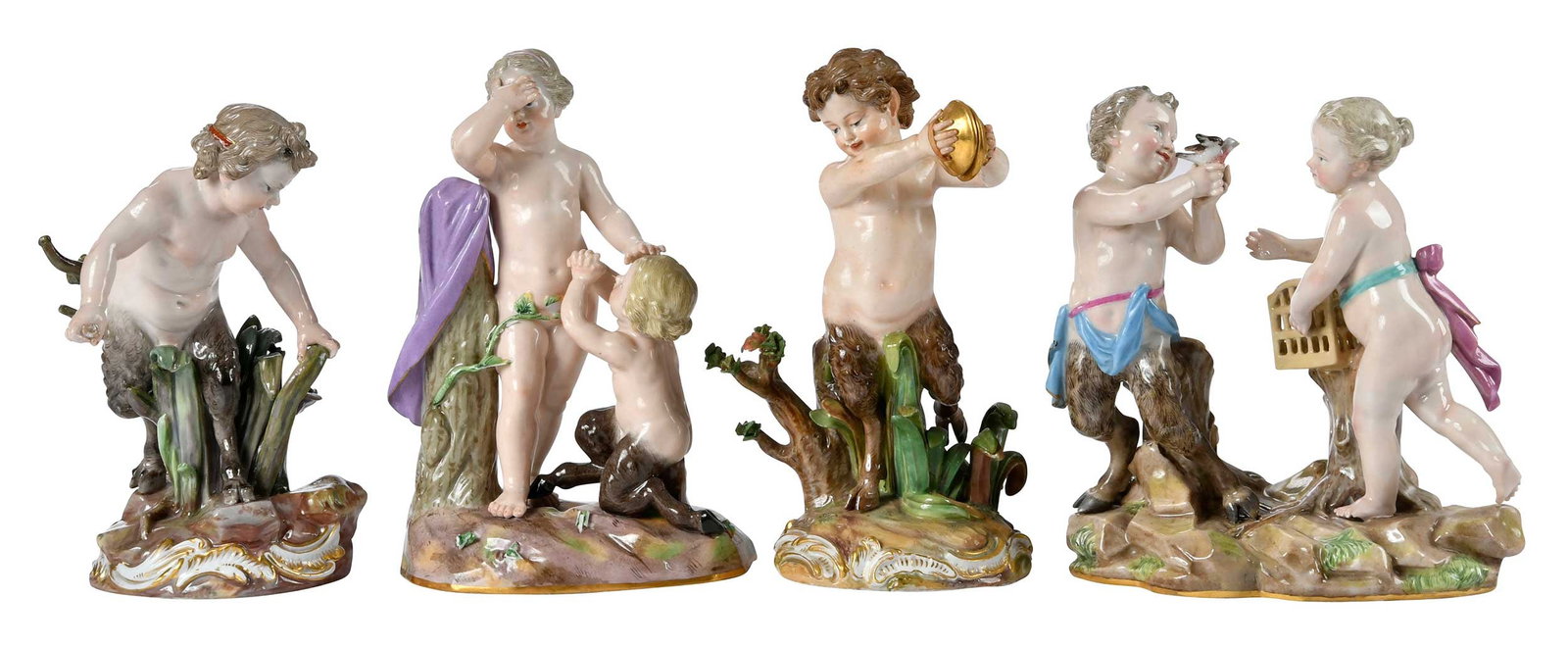 Four Meissen Porcelain Satyr Figural Scenes: German, 18th/19th century, each marked with underglaze blue crossed swords, comprising: Satyr, einen Reifen schlagend, marked "D 53" to base, 6-1/2 x 4-1/2 x 4-1/2 in.; Satyrgruppe, marked "D 26" to b