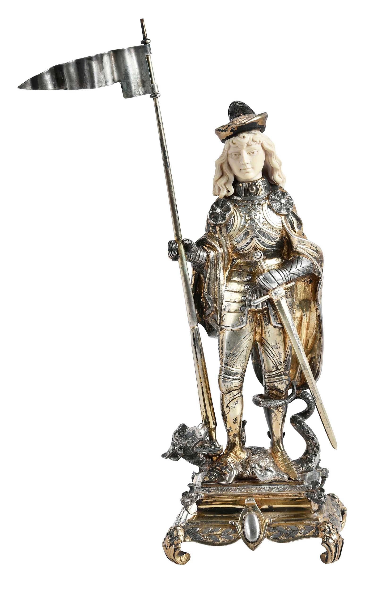 Gilt Silver St. George on a Dragon Figure: Continental, late 19th/early 20th century, St. George with flag and sword and standing on a dragon, scroll base, marked "Sterling" on base, ivory face, 23.72 oz. T. gross weight, 11-1/2 in.
