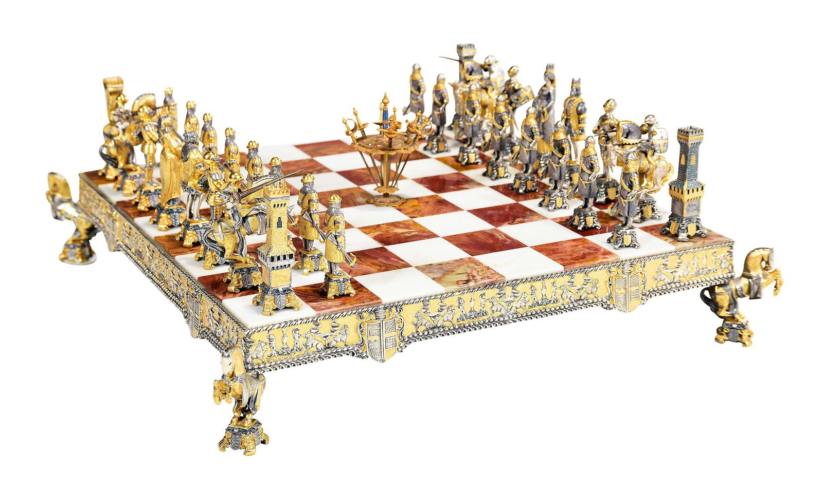 Piero Benzoni Gilt Bronze Mounted Agate and Marble Chess Set: (Italian, born 1938), 32 chess pieces, each marked "Piero Benzoni" verso, board 3-3/4 x 20-1/2 x 20-1/2 in.; together with a likely Toledo brass sword cocktail pick set, 4-1/8 x 3 x 3 in. Provenance: