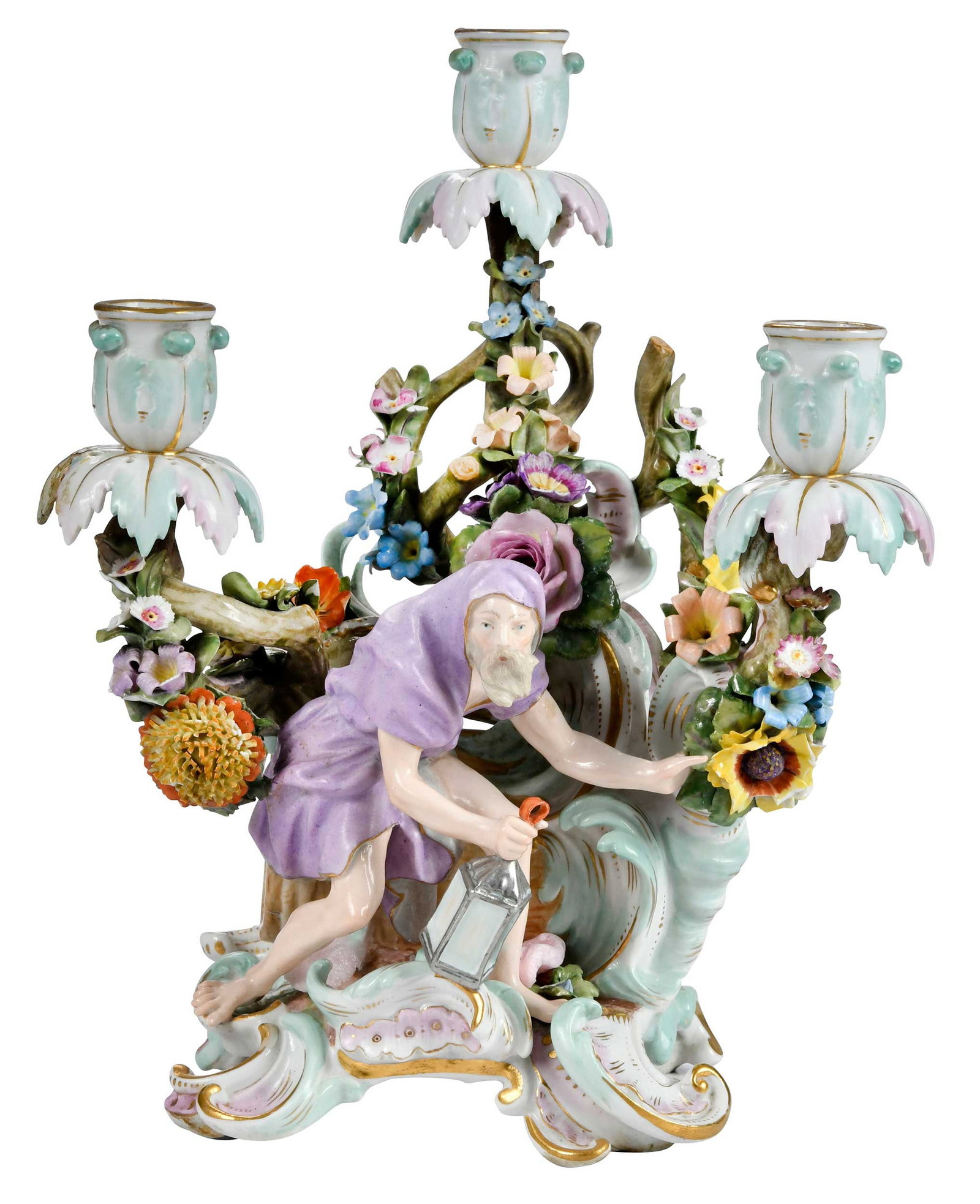 Meissen Porcelain Figural Candelabra: German, 19th/early 20th century, blue crossed swords mark to base, scrolled floral base issuing three arms centering Diogenes with a lantern, 11-3/4 x 9-1/4 x 6 in. Provenance: Collection of Steve Ste