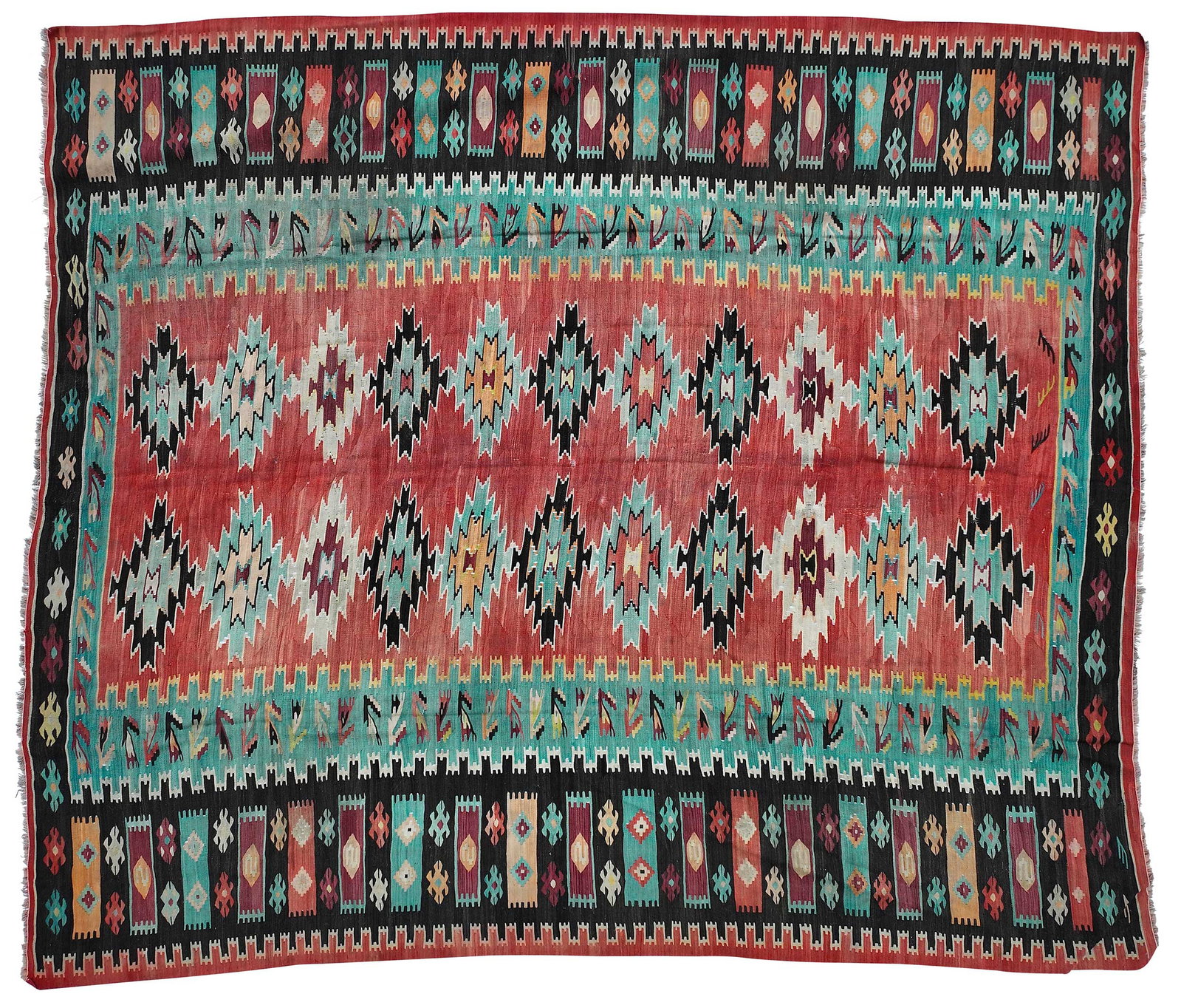 Kilim Carpet: first half 20th century, two rows of stepped diamond medallions on red field, thick interlocked borders, 11 x 9 ft. 4 in. Provenance: Private Collection, Asheville, North Carolina