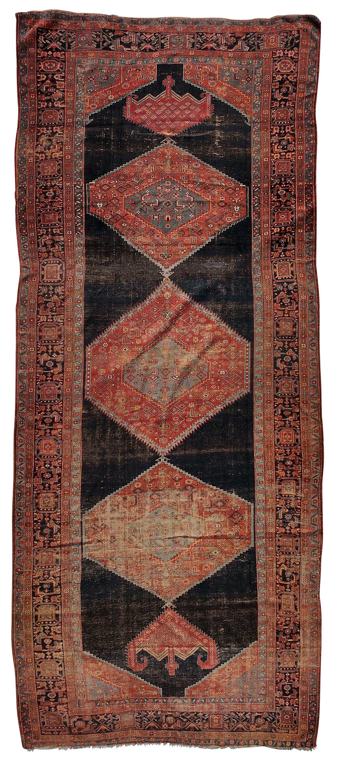 Turkish Gallery Rug: late 19th/early 20th century, three medallions on dark blue ground, dark blue main border, 16 ft. 9 in. x 7 ft. 3 in. Provenance: Estate of Lamar John Ryan Cecil, Lynchburg, Virginia