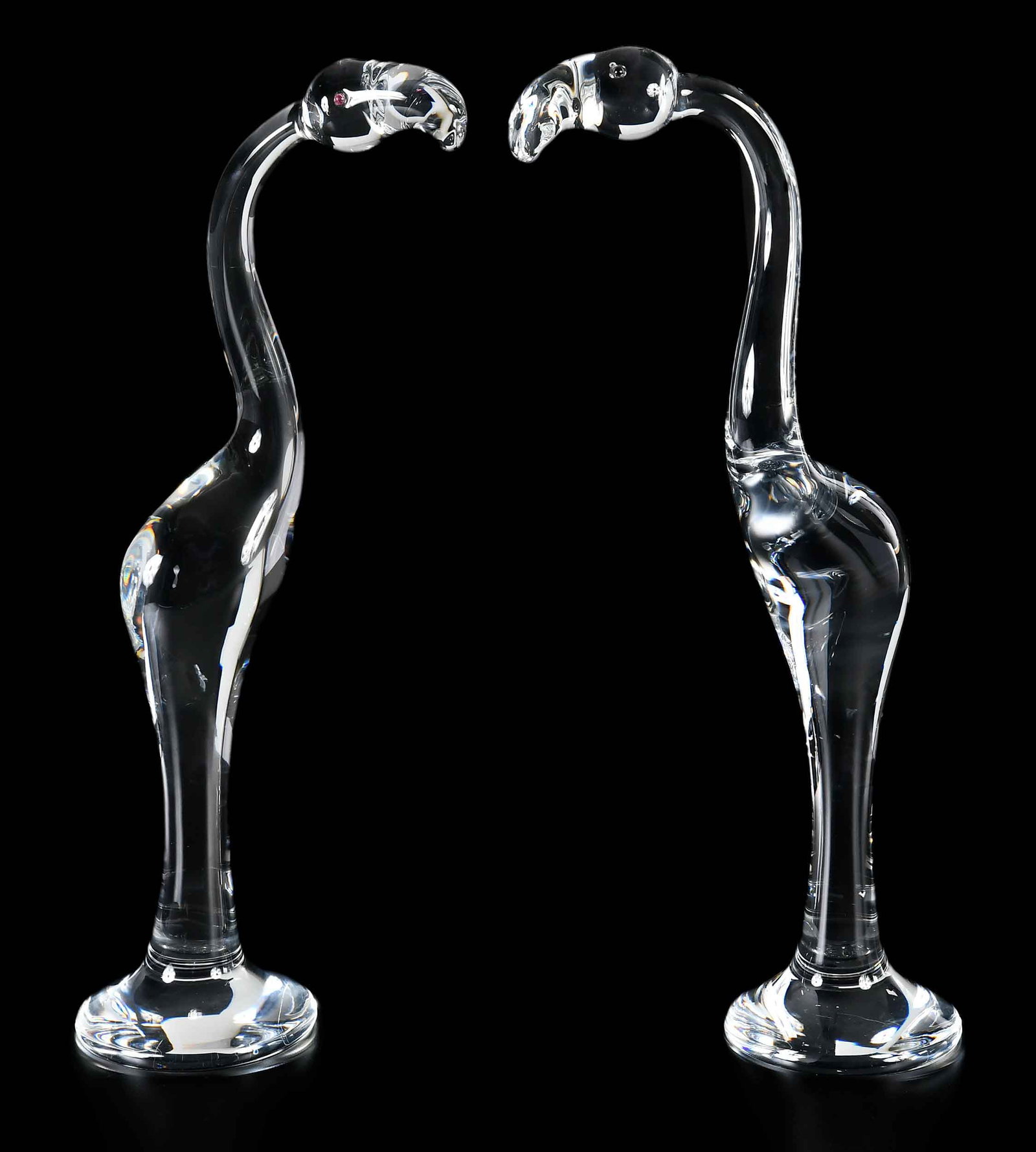Pair of Steuben Glass Flamingo Figures in Original Boxes: 20th century, Steuben marks to bases, each approx. 19-3/4 x 7 x 5 in.; in original velvet bag and box, 11-1/2 x 25-1/2 x 11 in. Provenance: Private Charlotte Collection