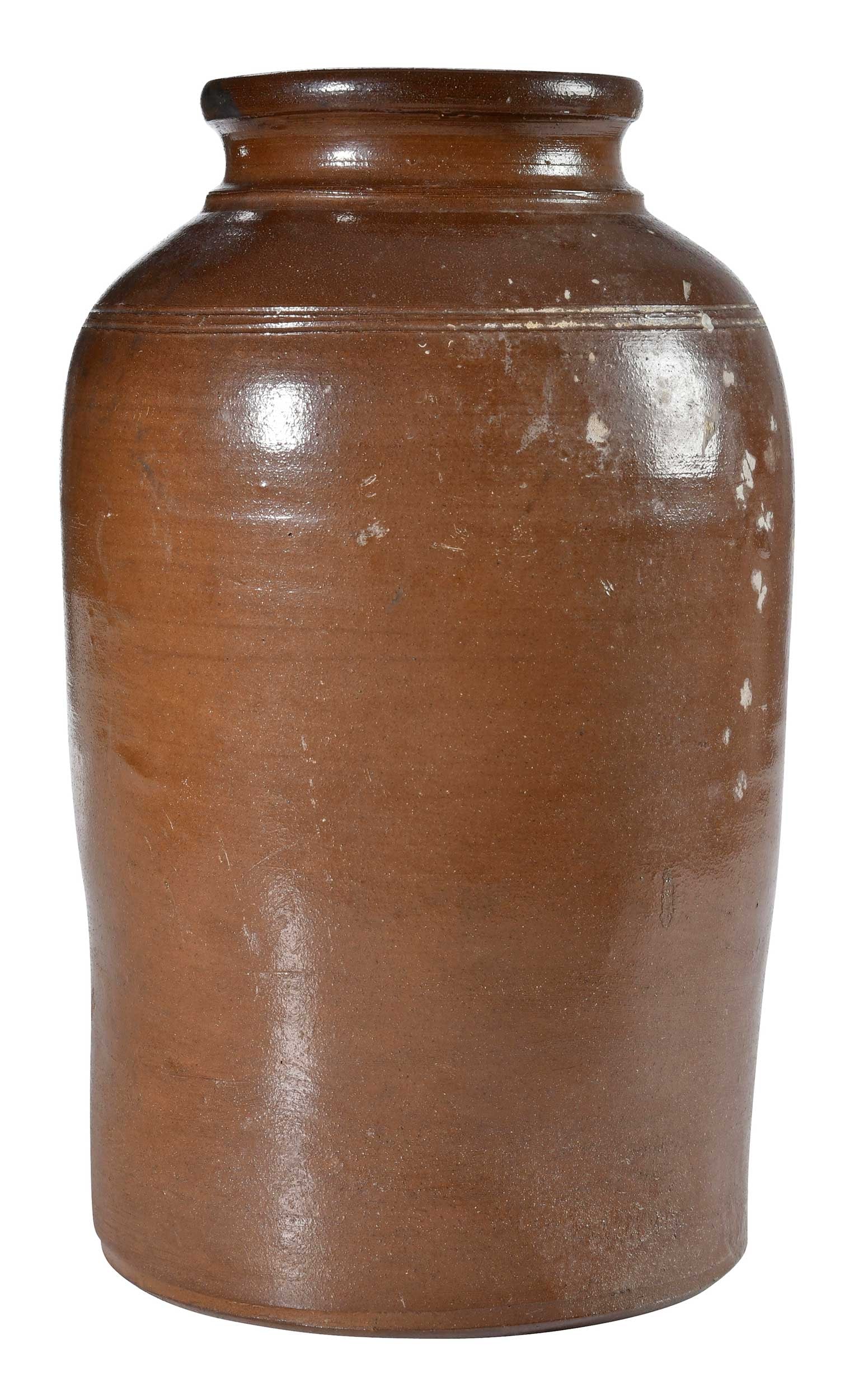 Yates Stoneware Jar Salvaged from the Confederate Blockade Runner Georgiana: mid 19th century, Albany slip glaze, cylindrical form, rounded shoulder, incised band at shoulder, ridged neck, rounded rim, Stamped "YATES", 14-1/2 in. Provenance: Private South Carolina Collection N