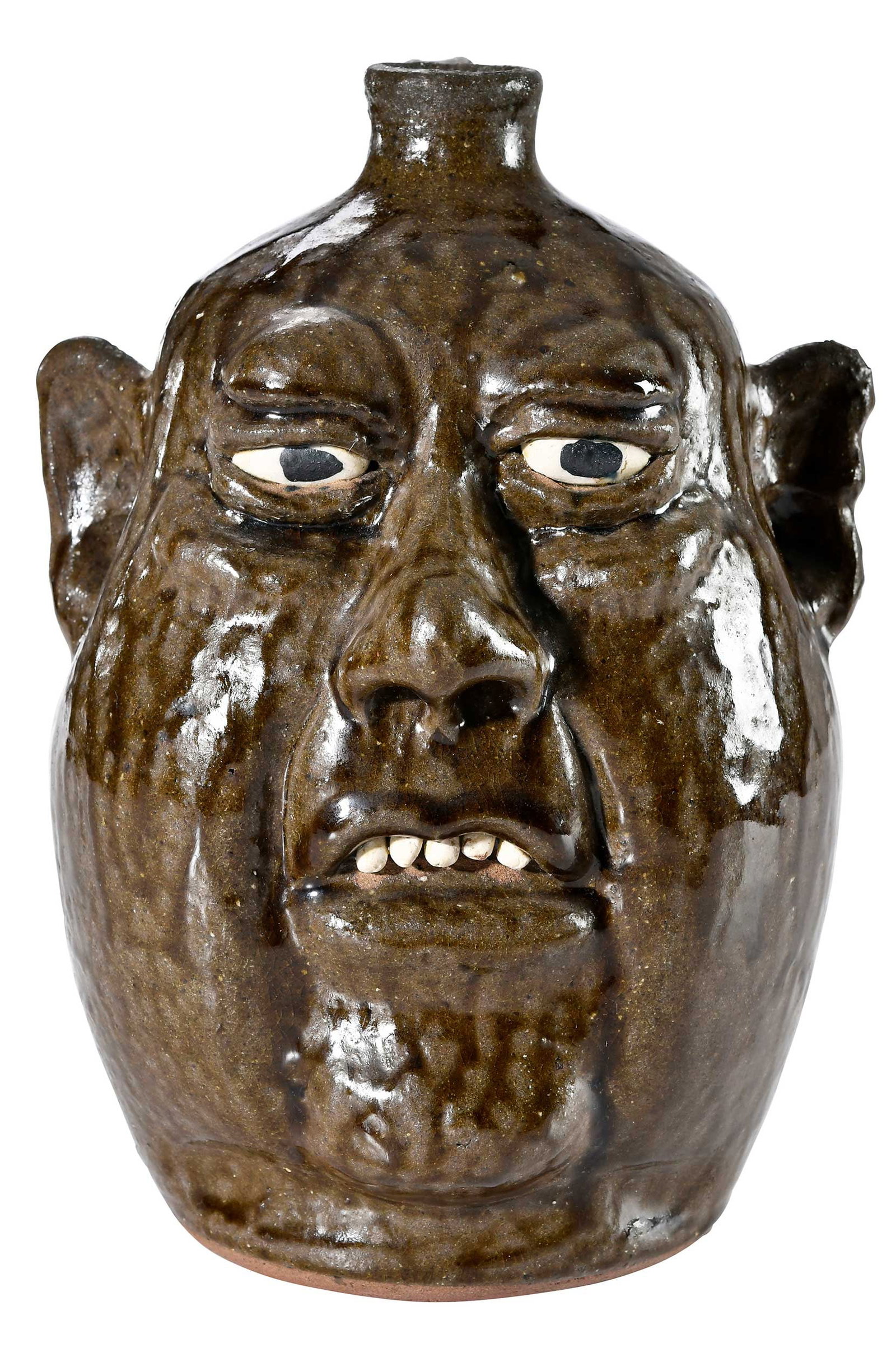 Lanier Meaders Georgia Stoneware Face Jug: Mossy Creek, Georgia, 1917-1998, runny olive green alkaline glaze, sculpted and applied facial features, white clay eyes and teeth, black pupils, straight spout, strap handle, inscribed "88 / Lanier M
