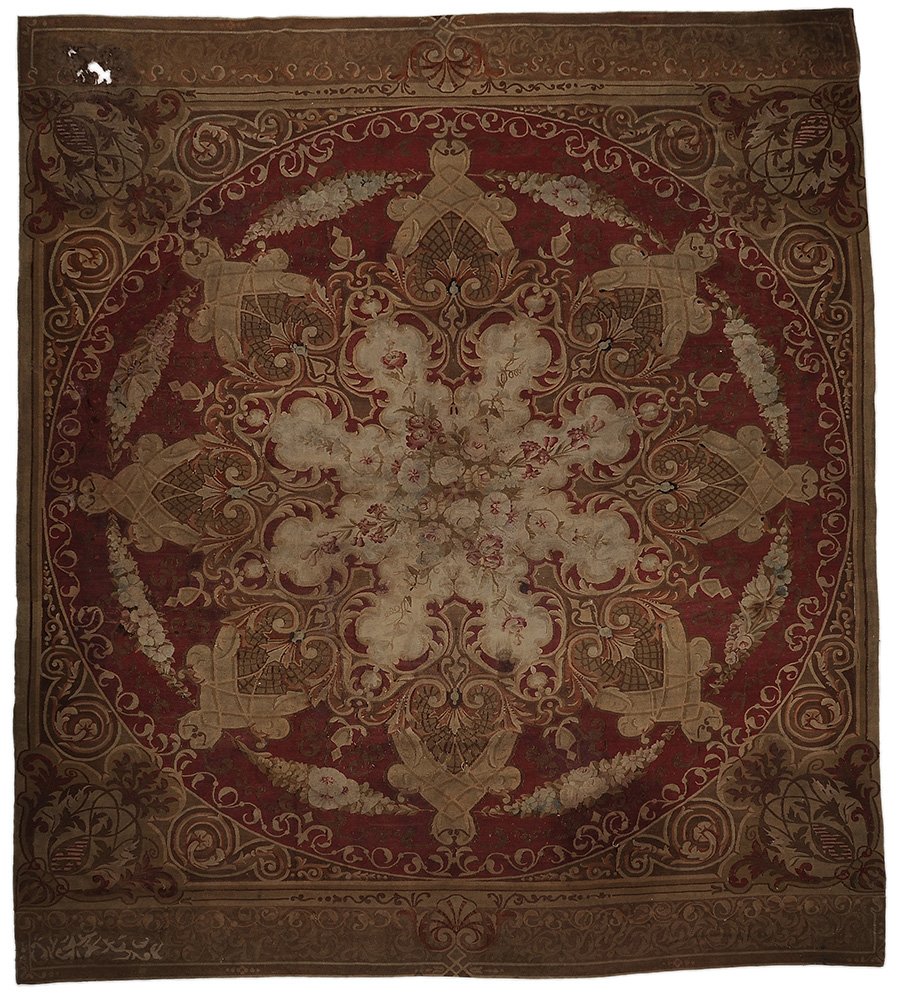 Aubusson Wool Tapestry-Woven: Carpet 19th century, floral decoration with artichoke-shaped pendants in a circular central medallion, floral and vine corner work and major borders, 11 ft. 2 in. x 12 ft. 2 in., fading, separations, 