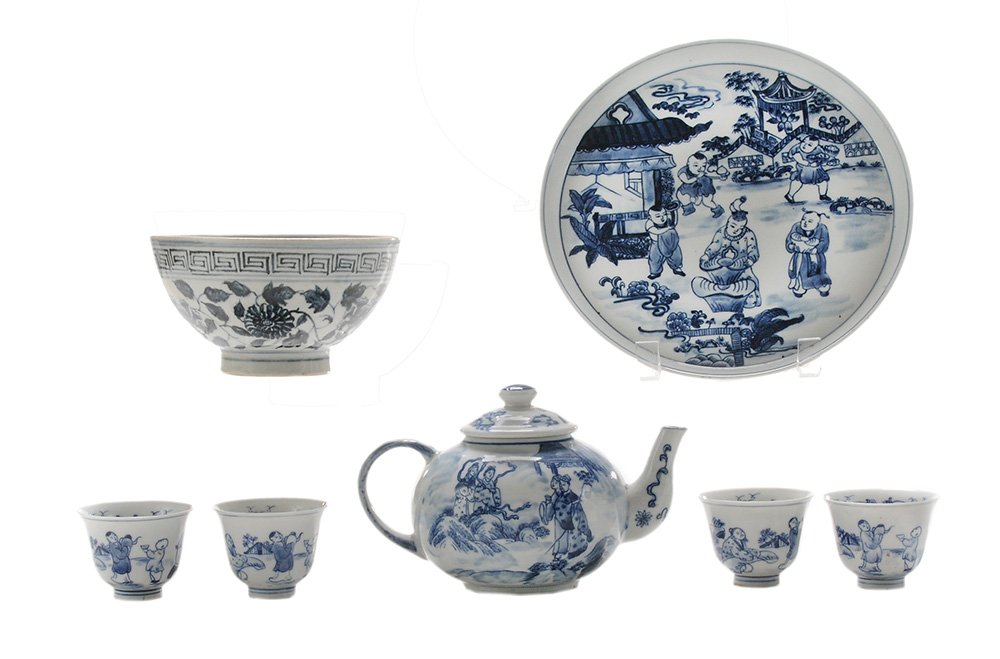 Blue and White Bowl, Teapot,: Four Cups and a Tray Chinese, 19th/20th century, blue and white floral and repeating banded bowl raised on a circular foot, [rough firing flaws to foot, wear to rim, minor scratches]; teapot and remov