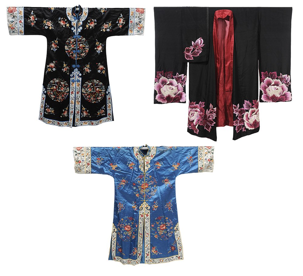 Three Embroidered Chinese Silk Robes: 20th century, one with pink peonies on black, batwing sleeves, matching sash, redlining, 48 in., [light stains in lining, light wear]; women's robe, embroidered roundrels, 44 in., [light wear]; embroi