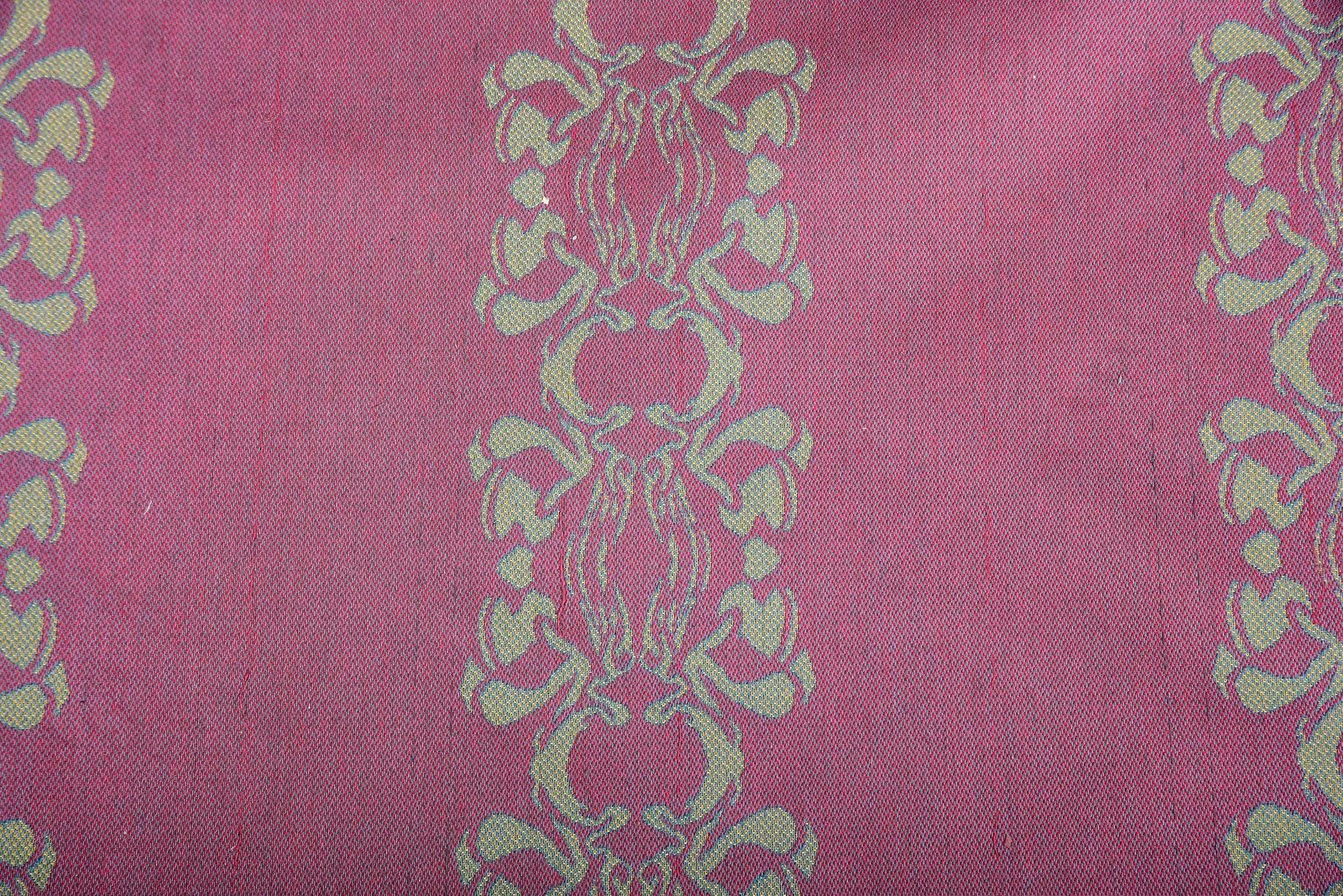 Three Bolts of Dutch Brinkman Design Upholstery Fabric: 20th century, two with repeated scrolled decoration, one solid, all in garnet and gold, largest roll approx.166 ft. x 4 ft. 10 in. Provenance: Private Collection, New York Note: Per consignor, this