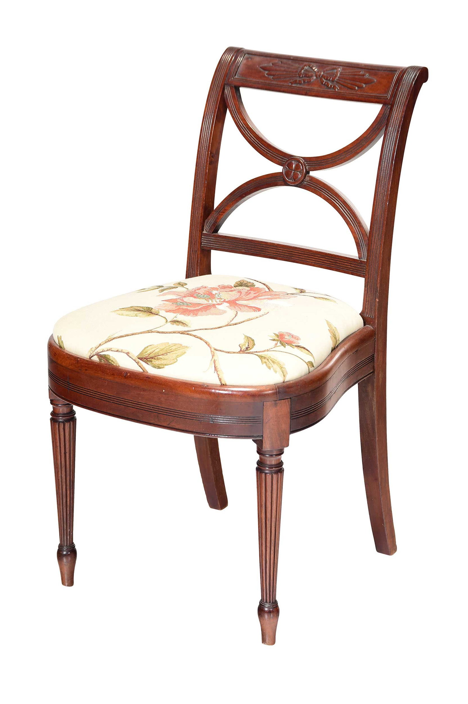 American Classical Carved Mahogany Floral Embroidered Balloon Seat Side Chair: New York, probably late 19th century, in the Duncan Phyfe style, crest rail carved with ribbon bound crossed rods, X shaped splat centering four leaf clover patera, reeded stiles and front legs, 32 x