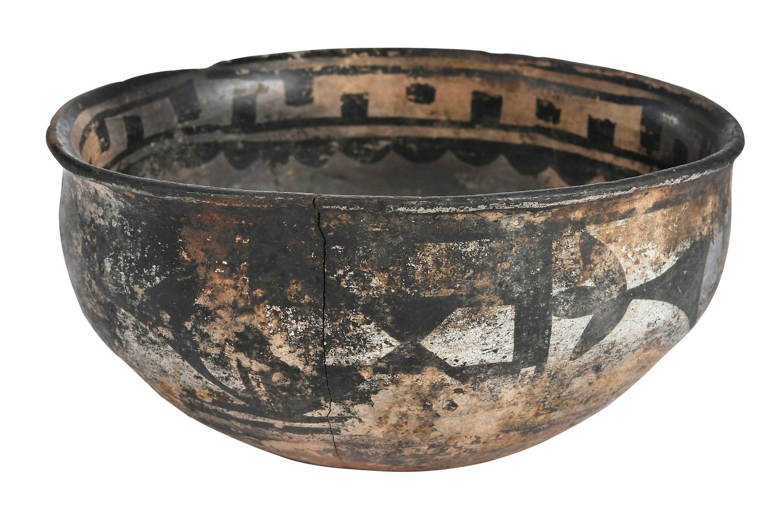 Pueblo Black on White Ceramic Bowl: with black and white floral and geometric slip decoration, 3-5/8 x 7-1/2 x 7-1/4 in. Provenance: Private Collection, New York