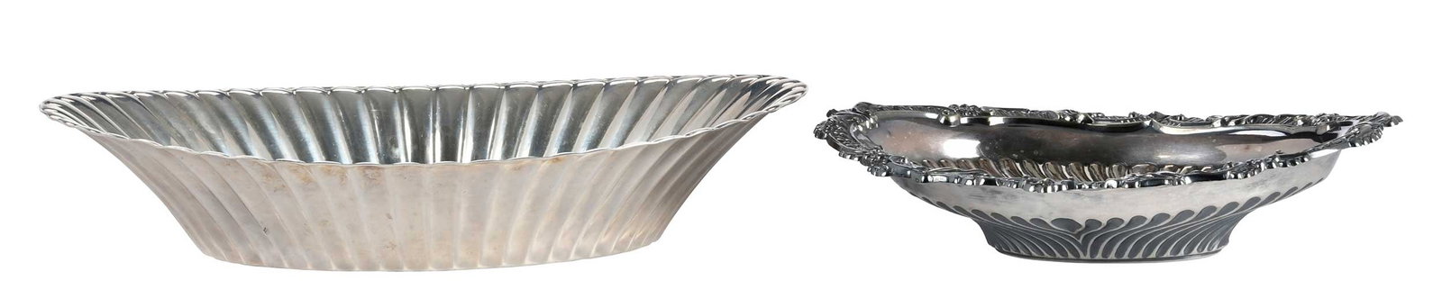 One Sterling and One Silver Plate Oval Bowls: 20th century, including Reed & Barton sterling reeded oval bowl, 9.01 oz. T., 9-3/4 in.; one silver plate, 7-1/4 in. Provenance: Private Collection, South Carolina