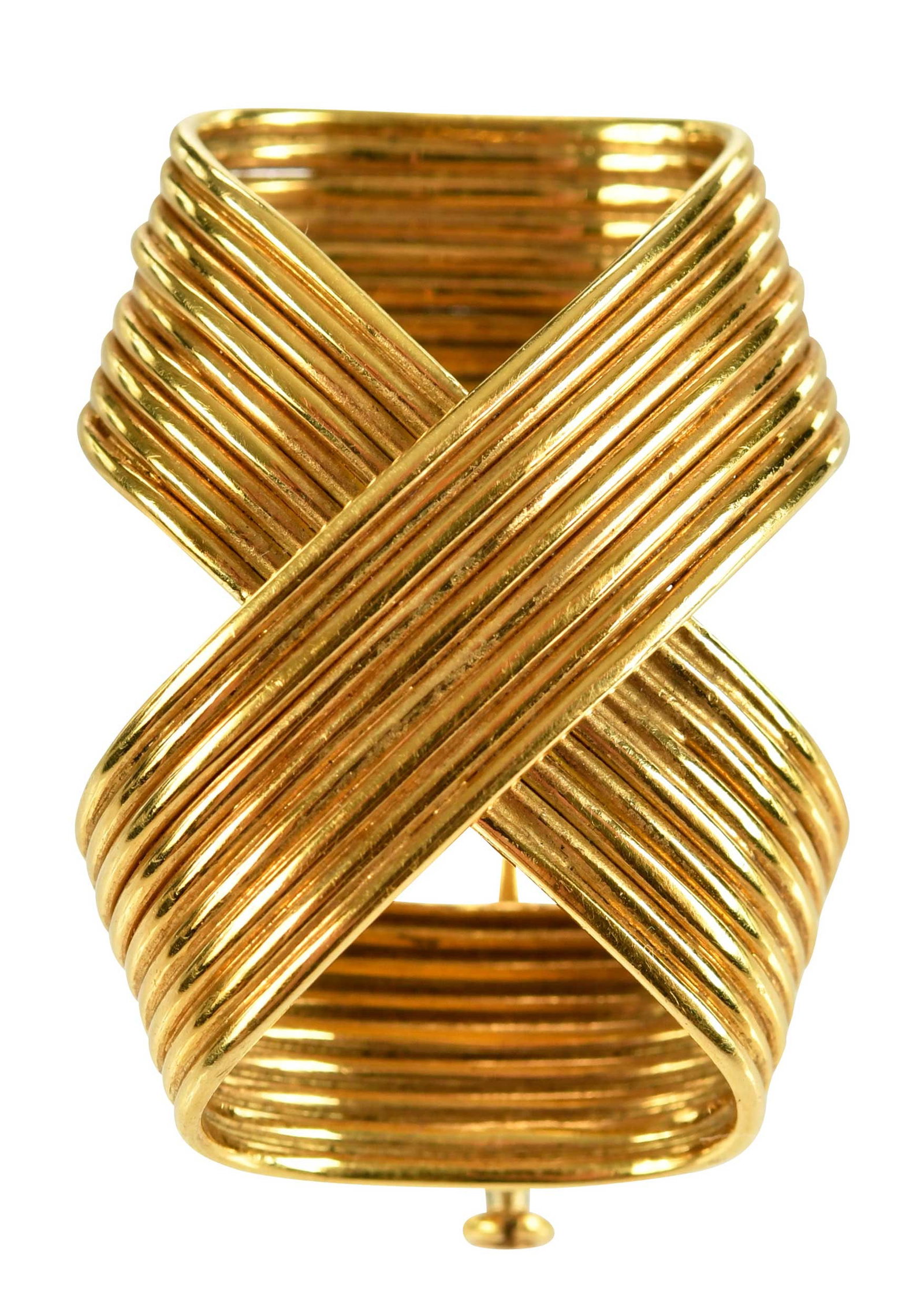 18kt. Tiffany & Co. Infinity Crossover Fur Brooch: high polish, ribbed texture, marked "18K, TIFFANY & Co", yellow gold, 1-1/4 in. length, 16.8 g, accompanied by Tiffany & Co. box Provenance: Private Virginia Collection Note: Brunk Auctions does not g