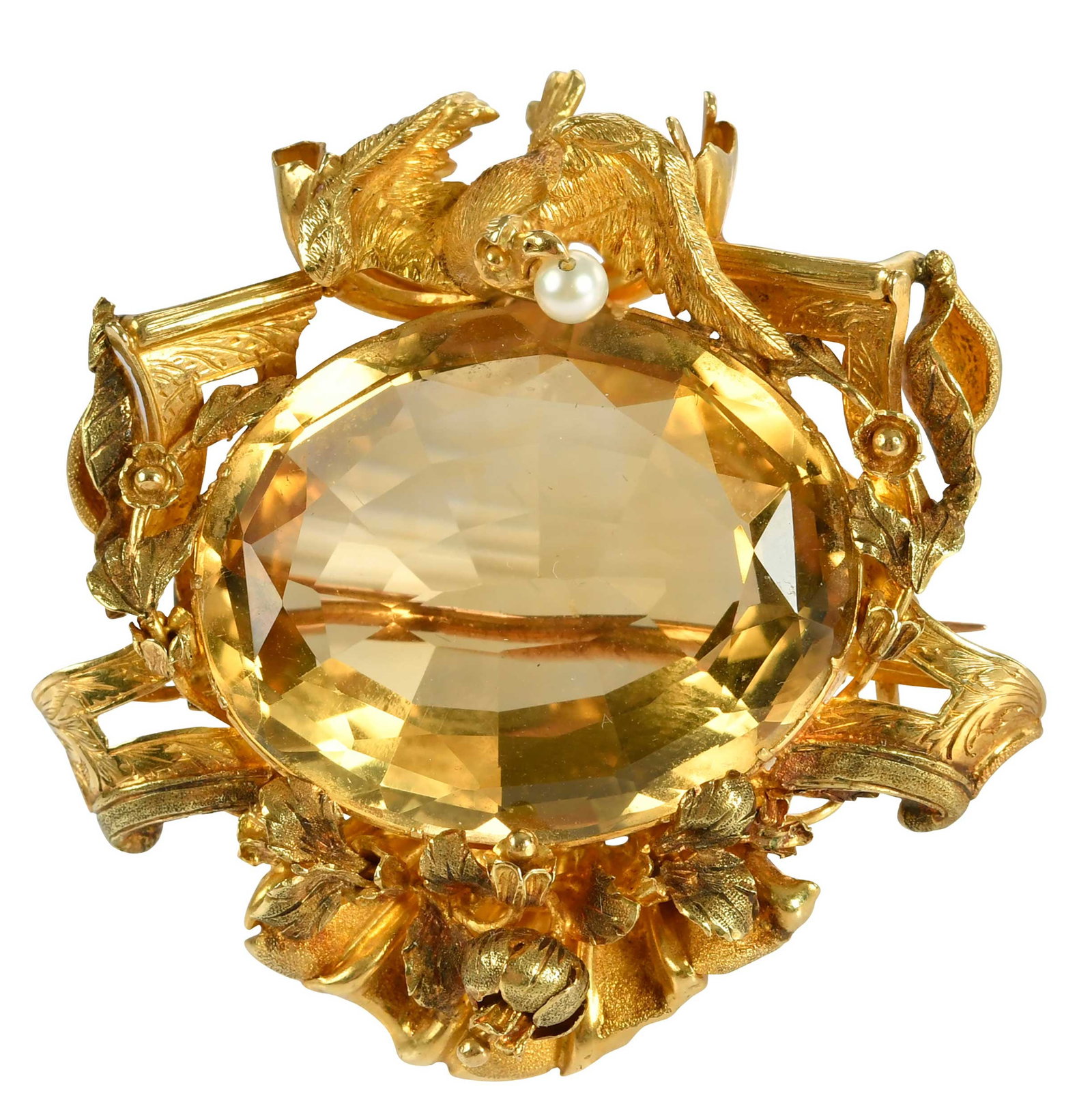 18kt. Edwardian Citrine and Pearl Brooch: oval mixed cut citrine, approx. 28.0 x 23.0mm, one seed pearl, tests 18kt. yellow gold, 17.5 g Provenance: Private Virginia Collection Note: Brunk Auctions makes no warranty or guarantee regarding any
