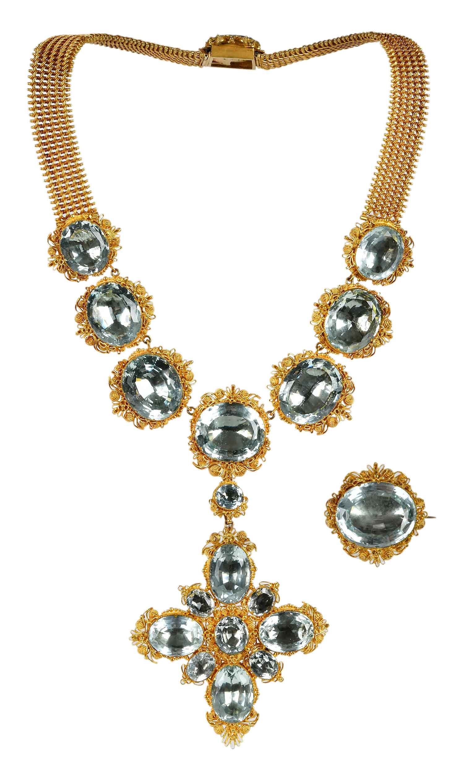 Georgian Aquamarine Cannetille Suite in Original Fitted Leather Case: comprising: intricate 18kt. yellow gold filigree necklace, 15-1/2 in. length, 13.0mm wide mesh chain, removable pendant brooch, 3-1/4 x 2-1/2 in., brooch, approx. 1 x 2-1/16 in., oval mixed cut aquama