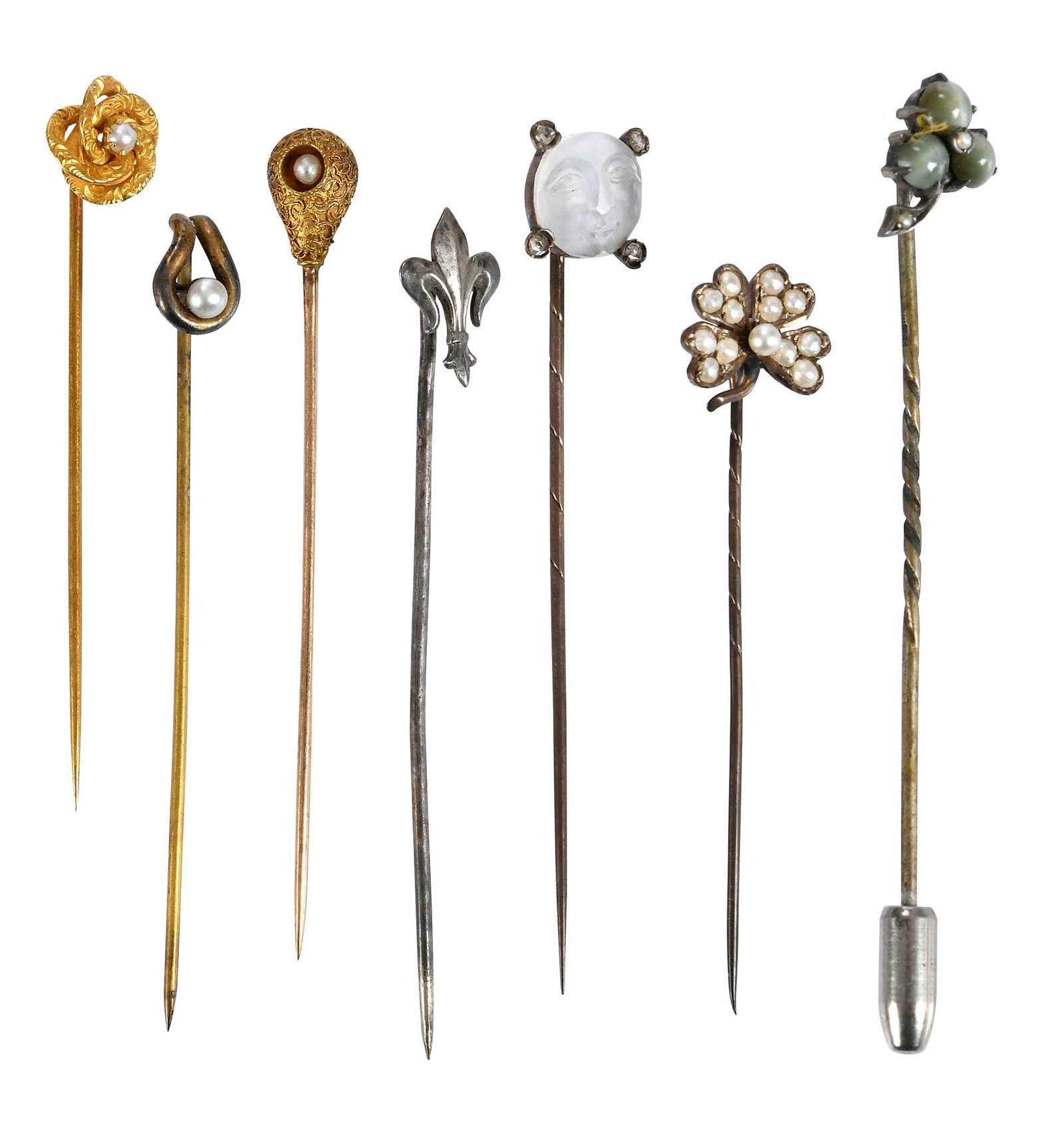 Collection of Seven Assorted Stickpins: comprising: four with white pearls, two 18kt., one 14kt., one 9kt. gold, carved moonstone moon face with four old cut diamonds, stick pin tests not gold; round cabochon chrysoprase cat's eye, tests no