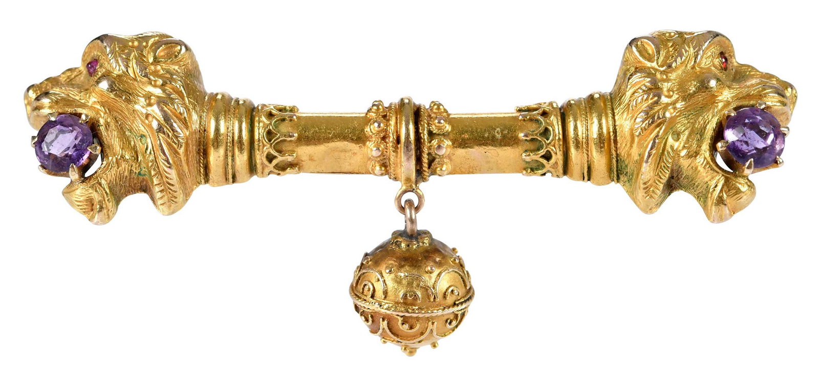 14kt. Etruscan Revival Double Lion's Head with Amethyst Bar Brooch: two round faceted amethysts, approx. 4.5mm, two round cabochon ruby eyes, tests 14kt. yellow gold, 2-3/8 in. length, 16.8 g Provenance: Private Collection, Asheville, North Carolina Note: Brunk Auctio